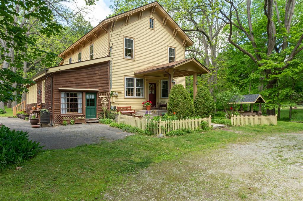 The BENEFIT of this Parshallville Village historic home... UPDATED REMARKS follow:The BENEFIT of this Parshallville Village historic home... There are MANY.  Let's start with the home and quest cottage each with an abundance of adoring history to share, then there is the nearly ?? acre lot with mature trees / flowering gardens / beautiful natural country setting / deer and wild turkey / lush vegetation.  Now the safe, quiet and peaceful location of the Historic Village of Parshallville (located near Fenton & Hartland) with Hartland Schools (Excellent).  You get the historic charm from the original structures, all of which have been lovingly maintained and the rare yet amazing opportunity to live in and love Parshallville.  Ask to see "The Parshallville Schoolhouse" writeup.  Some of the basics, Primary Home: 3 to 4 bedrooms, 1 full bathroom, 1 lavatory, ample square feet, large 2nd floor loft, Artist Studio, four season room, wood burning stove that will heat the entire house, large open living room / dining room / entry (original school house and general store locations), two decks, large patio, backyard and side yards filled offer a genuine country setting, floor gardens, ample storage, detail and more detail, charm and more charm... THIS PROPERTY IS SPECTACULAR. Guest Cottage: Open studio plan with bed area, living area, kitchenette, and bathing room (former location of the local barber).  This home is located less than 0.1 mile from the center of the village, newly finished damn, water way, big and beautiful Parshallville pond and historic Parshallville cider mill (built in 1869 and now offers the best donuts and cider).  This home makes the premiere homestead and destination spot for private parties, events, and hanging out enjoying time with friends and family.  For what this home has to offer, and at this price, it's bound to get a lot of attention... so come see your future in this treasured Historic Home!  Call today for a private viewing or tour at one of the planned Open Houses.  Need a bridge, convent