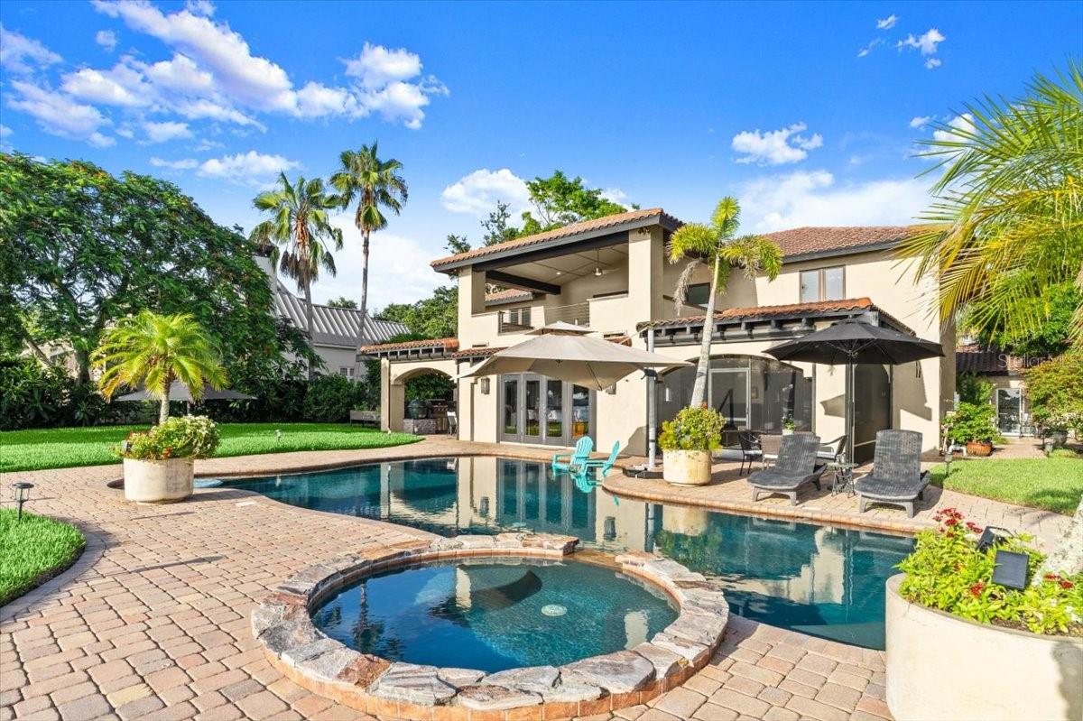 100' of Direct Intracoastal Frontage • Private Floating Dock with Water, Electric and Lift • Central Beachside Hamlet • Most Coveted Waterfront Street • Serious Boaters and Entertainers this is your Legacy Address.
Welcome to 206 Canova Drive, a Tuscan-Inspired Waterfront Estate unlike anything else in New Smyrna Beach. Set on a rare 100 feet of Direct Intracoastal Waterway with Deep Water Access, a 55’ Floating Dock accommodating Vessels up to 80', and a Boat Lift, this home is the ultimate blend of Luxury, Privacy, and Lifestyle.
Privately tucked away on Canova Drive, a street known only to Locals and steeped in NSB History, this estate offers more than just Location. It offers Legacy. The street itself was built around the historic grave of young Charles Dummett, killed in a hunting accident and buried where he fell by his grief-stricken Father in the early 1860s. It is a place full of stories, secrets, and that rare “IYKYK” charm.
With over 4,000 SF of Living Space, this 5 bedroom, 4 bath Compound (including a Detached Guest House/In-Law Suite) is an Entertainer’s Dream and Boater’s Paradise. Hosting is effortless with room to accommodate 150+ party guests, multiple Indoor-Outdoor Living Areas, a Gourmet Outdoor Kitchen, and two screened-in Patios with automatic Roll-Down Screens.
The main home welcomes you through a Private Courtyard into soaring Ceilings, natural Light, and an open layout that celebrates both Comfort and Grandeur. The Chef’s Kitchen features a Gas Range, white cabinetry, Granite Countertops, Premium Appliances, and a Breakfast Bar, all flowing into the cozy Family Room and formal Dining space with panoramic River Views.
Retreat to the spacious Primary Suite, complete with a tastefully redone Spa-Style Bath and a Private Balcony overlooking the ICW, framed by gas fire lamps—the perfect setting for sunset Cocktails or quiet Reflection. Additional upstairs bedrooms include one with a Juliet Balcony and another with serene Water Views.
Need space for Work or Wellness? There’s a Private Office with Wine Storage, a Bonus Room with Sauna, and even a Home Gym.
The detached Guest Studio offers a full Kitchen, private bath, and covered porch with Water Views—ideal for guests, in-laws, or long-term stays.
Outdoors, the Resort-Style Pool area stuns with PebbleTec finish, Tanning Ledge, In-Water Seating with Umbrella, Spa, and Fire Pit—all surrounded by Lush Landscaping and Sunset Views that will take your breath away.
Located just a Short Walk to Flagler Avenue, you are steps from Fine Dining, Shopping, and Nightlife, but tucked away in a world entirely your own.
Whole-House Generator, two new HVACs, commercial-grade LVP flooring, and more upgrades throughout.
This is more than a home, it is a Lifestyle, a Legacy, and a Best-Kept Secret only New Smyrna insiders know about.