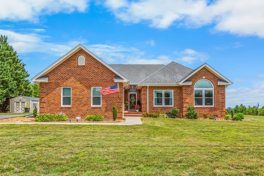Extensively updated & ready for its next owner! This all-brick, one-level ranch offers 3 bedrooms, 2 bathrooms, & sits on approximately 1 acre in Cana, VA. Recent improvements include new windows, new sliding doors, new garage door and opener, tankless water heater, stainless steel appliances, fresh paint throughout, hardwood floors, & an expanded and repaved driveway. The primary & hall baths have both been completely renovated making this home truly move-in ready. The attached 2-car garage provides convenience & storage, while an additional storage building offers space for lawn equipment, tools, & hobbies. Enjoy the covered patio off the kitchen or the open patio off the living room while taking in the views. Conveniently located minutes from Highway 52, the Blue Ridge Parkway, and I-77, this property combines updated one-level living with easy access to the region's most popular destinations. Work from home? No problem, Spectrum Fiber Internet! What are you waiting for? This is it!