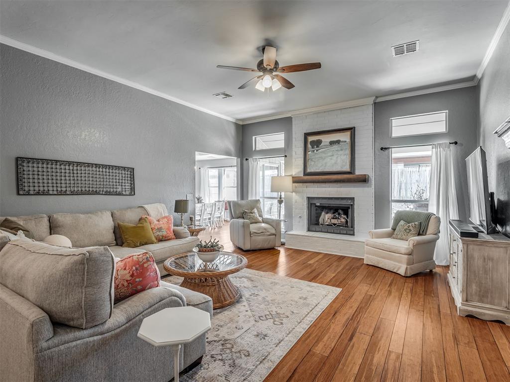 Welcome to this cute, beautifully remodeled home featuring 3 bedrooms and 2 bathrooms, thoughtfully updated with style and functionality throughout. Bamboo hardwood floors greets you upon entering and anchors the main living area which leads into the kitchen perfect for relaxing or entertaining. The living area offers lots of space with a fireplace as the focal point, as well as spacious built-ins.  It’s also wired for surround sound, adding to the home’s modern appeal. The kitchen is a true centerpiece with designer backsplash, gorgeous countertops, and an oversized island ideal for gathering. You’ll love the abundant cabinet space and stainless steel appliances, creating a kitchen that’s both stylish and highly functional which include a great dining area with lots of windows for natural light.  The private primary suite easily accommodates a king-size bed with room to spare. A custom barn door leads in to the primary bath featuring a remodeled walk-in shower, dual vanities and an Australian-style closet layout for exceptional storage and organization. Secondary bedrooms are generously sized, each with great closet space, and a full hall bath featuring timeless subway tile finishes and stylish vanity area.  Additional highlights include ample storage and extra closets throughout, a remodeled laundry room with a custom pull-down folding table and designer tile, all thoughtful details that make everyday living easy. Step outside to an extended patio with pergola, perfect for outdoor gatherings and relaxing evenings. Major updates include a new roof in 2023, HVAC approximately 6 years old, and concrete pads for trash bins for added convenience. This move-in-ready home blends charm, comfort, and modern updates—one you won’t want to miss!