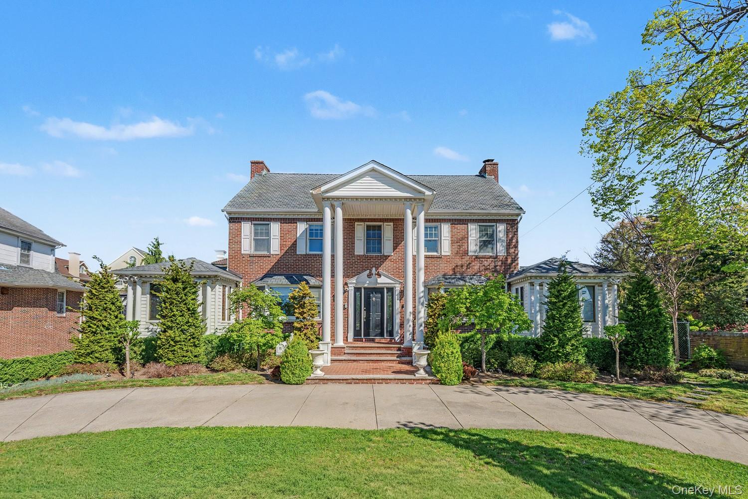 Set on an oversized approximately 87' x 121' lot in the prestigious Malba enclave, this stately residence offers a rare opportunity to create a refined home in one of Queens’ most exclusive waterfront communities. With generous proportions, classic architectural details, and expansive outdoor space, the home provides an exceptional foundation for a thoughtful renovation.A circular driveway enhances the home’s presence and provides convenient access to a two-car garage. From there, you are welcomed inside by a beautiful front entryway that introduces the home’s character and scale. The first floor unfolds into a formal dining room, with crown molding featured throughout much of the home, along with an adjacent office. A spacious living room with a fireplace serves as the heart of the home, while an additional room offers flexibility for a den, playroom, or private sitting area.The eat-in kitchen is complemented by a half bath and a dedicated laundry room, and opens directly to a large patio. Perfect for outdoor dining and entertaining, this space allows for a seamless indoor to outdoor lifestyle ideal for gatherings or quiet everyday enjoyment.Upstairs, the second level features three bedrooms and two full bathrooms, including a primary suite with its own private bath, as well as a second full bathroom serving the remaining bedrooms.A finished attic level offers two additional rooms that can be used to suit your needs, whether for a home office, guest space, gym, or creative studio.The renovated full finished basement provides valuable additional living space, ideal for a media room, recreation area, home gym, or extended living quarters, depending on your needs.For buyers seeking to personalize a home without starting from the ground up, this property presents a unique opportunity to renovate and elevate an already substantial residence into a custom luxury home. The expansive lot further enhances the offering, allowing for curated outdoor living, landscaping, or future enhancements.Positioned on a tree lined block within Malba, the home offers a rare balance of privacy and accessibility, with close proximity to the waterfront, major highways, and an easy commute to Manhattan.Opportunities to create a bespoke residence in Malba are limited.*Some photos are virtually staged