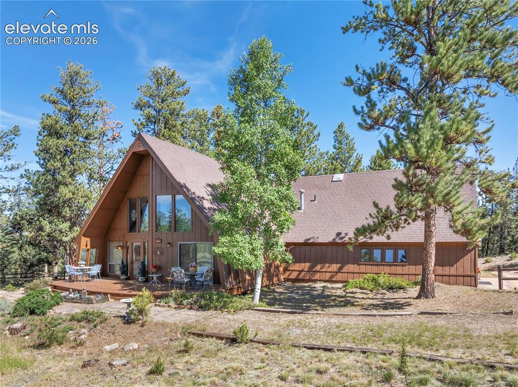 Not every mountain home follows the rules... and this one never got the memo.Tucked away on 4 beautiful acres bordering Pike National Forest, this delightfully quirky mountain retreat offers the kind of setting that buyers spend years searching for—level usable land, direct access to hiking trails, abundant wildlife, and jaw-dropping views of Pikes Peak right outside your window.The home itself? Let's just say it's bursting with personality.With 2 bedrooms and 2 bathrooms, the layout is as unique as the Colorado mountains that surround it. One bedroom and bath are conveniently located on the main level, while the second bedroom and bath occupy the loft above. The primary bedroom is hidden behind a bookshelf that doubles as the wall and door—because ordinary doors...well, they get boring.Inside, you'll find a home that's ready for its next chapter. A wonderful home with a vintage vibe that awaits a buyer with vision, creativity, and an appreciation for casual mountain charm. Whether you're dreaming of a summer home, a rustic weekend getaway, or a one-of-a-kind mountain residence, the possibilities here are endless.Additional features include a detached 2-car garage, an attached 1-car garage, and a sunroom/game room perfect for morning coffee, afternoon card games, or simply watching the wildlife wander by.If you've been searching for a property with perfect finishes, this may not be your match. But if you've been searching for a property with incredible land, unmatched access to nature, unforgettable views, and enough character to make it your own, you've just found it.And while you will feel like you are tucked away in the middle of the forest, you are only 10 minutes to downtown Woodland Park and 30 minutes to Colorado Springs.  All the amenities and none of the crowds!Come explore this hidden gem where the forest is your backyard, adventure starts at your property line, and the bedroom is literally behind the bookshelf.