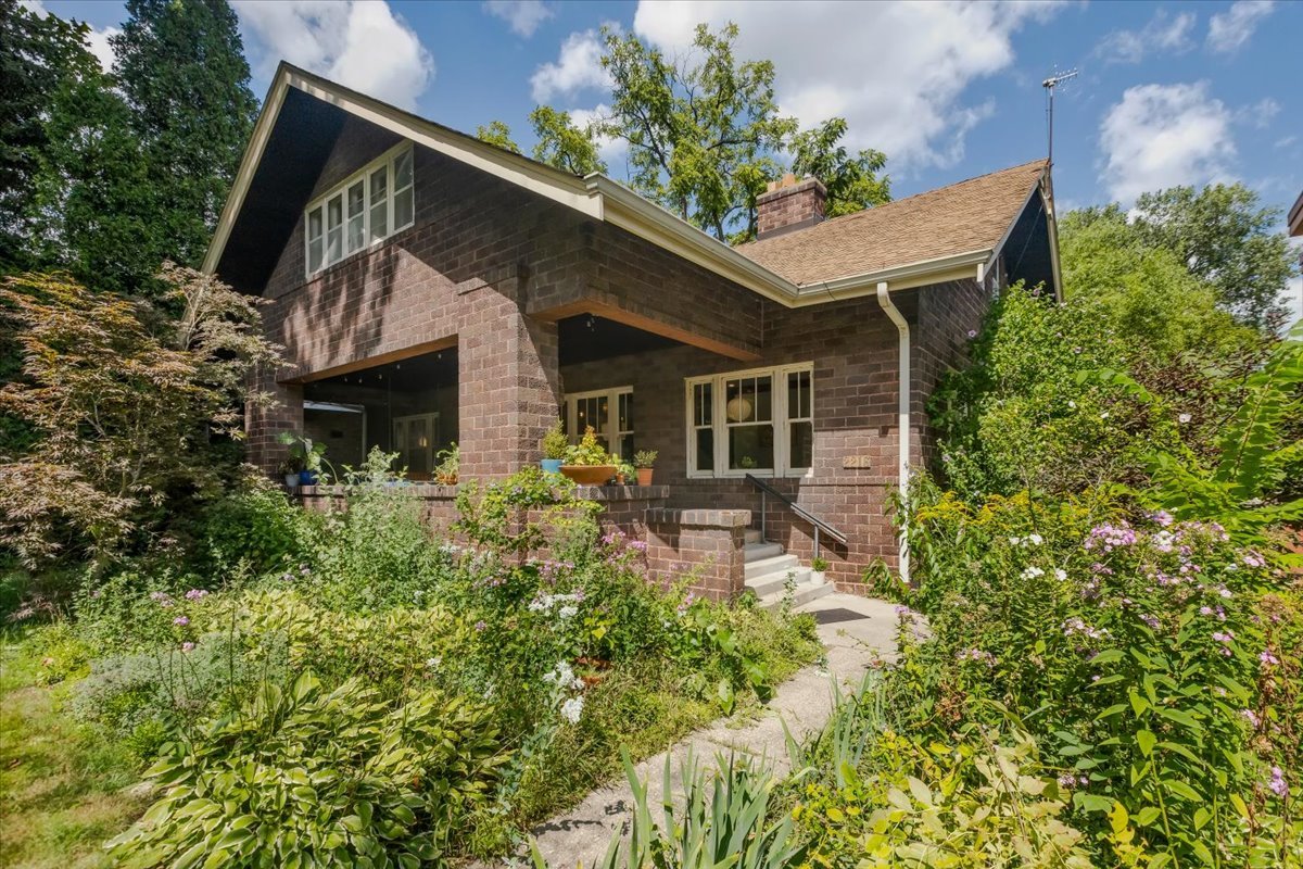 Step into a piece of Chicago history with this meticulously updated residence, circa 1910. Originally built by a discerning homeowner who chose the beloved bungalow style for this expansive, extra-wide lot, the updates seamlessly blend historic charm with modern luxury.    A generous setback from the street creates a sense of privacy and grandeur, offering a welcoming approach to the home. Similarly, the oversized rear yard provides a rare urban oasis with ample space for outdoor activities, gardening, and entertaining. A welcoming feature of this home is the expansive front porch, subtly screened by a mature Japanese maple. It's perfect for entertaining guests or simply relaxing on a sunny spring afternoon while you enjoy the neighborhood's charm and substantial front yard.    Inside, the home has been thoughtfully reimagined while preserving its original character. The main level boasts a high-end, open kitchen featuring custom white and walnut cabinetry with functional, high-end drawer and pantry pull-out hardware. Built-in appliances include a Sub-Zero refrigerator, a perfect combination of form and function for culinary enthusiasts and entertaining. Make dinner while taking in a view of the rear yard.    Hardwood floors flow throughout the home, leading to a spacious living room centered by a fireplace. Original details, including beautifully preserved wood windows, doors, a staircase, trim, and moldings, add to the home's unique appeal. The main level also features two generously sized Jack and Jill bedrooms and a tastefully appointed full bath, offering comfortable living spaces.    Ascend the original hardwood terraced staircase to find three spacious bedrooms, including a luxurious primary suite with a perfected layout. This suite is a true sanctuary, featuring a modern freestanding tub, dual vanities, gorgeous tile work, and a glass-walled tiled shower. A conveniently located laundry area and ample closet space enhance the suite's functionality. A large family bath on the second floor with dual vanities, a separate tub, and shower caters to family and guests alike.    The extra-deep, finished basement provides even more living space, featuring a massive family room, a fourth full bathroom, an office, and a workshop, along with an exit to the rear yard. This space offers endless possibilities for recreation and storage.    Modern comforts and efficiency are paramount. The home boasts updated mechanical systems, including a zoned high-efficiency HVAC system, ensuring year-round comfort and energy efficiency. Out back, a brick two-car garage and oversized rear yard, complete with a covered patio, are ideal for outdoor gatherings and relaxation.    More than just a home, this is a piece of Chicago's architectural legacy, thoughtfully updated for modern living. Don't miss the opportunity to own this exceptional property.
