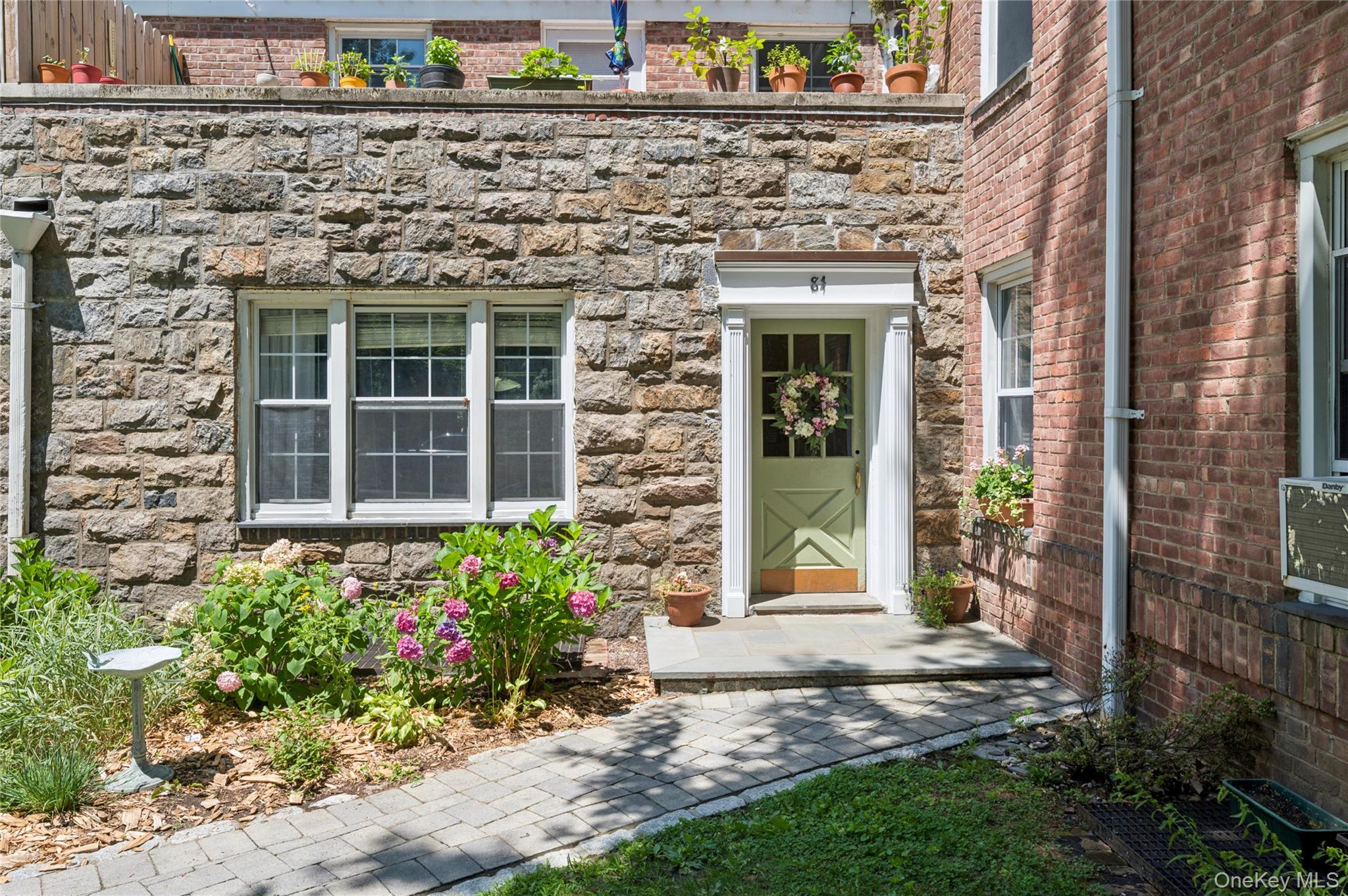 **Beautiful Move-In Ready Living at Pinewood Gardens**Welcome to this spacious and beautifully updated one bedroom residence in the highly desirable Pinewood Gardens community in Hartsdale. Combining timeless charm with modern updates, this inviting home offers unassigned parking, assigned storage, beautifully maintained grounds, a playground, barbecue area, convenient laundry in basement and the convenience of an on-site superintendent.A welcoming entry foyer leads into an expansive, thoughtfully designed floor plan featuring gleaming hardwood floors, elegant crown molding, and abundant natural light throughout. The oversized living room offers exceptional flexibility for both everyday living and entertaining and is anchored by a **fully functioning wood-burning fireplace** a rare and inviting feature that creates warmth and character. A separate dining area provides the perfect setting for gatherings, while an additional Bonus area  offers an ideal space for a home office /Guest room.The renovated kitchen is both stylish and functional, featuring abundant cabinetry, generous pantry storage, stone countertops, stainless steel appliances, and a decorative tile backsplash designed to complement today's lifestyle.A spacious bedroom with corner windows provides excellent natural light and ample room for additional furnishings.Life at Pinewood Gardens offers the comforts of homeownership without the exterior maintenance. Professionally landscaped grounds are meticulously maintained, allowing residents to enjoy the community year-round with minimal upkeep.Ideally located between Hartsdale Village and downtown White Plains, you'll enjoy convenient access to restaurants, shopping, fitness centers, parks, golf courses, farmers markets, and the scenic Bronx River Parkway trails. Just minutes from the Hartsdale Metro-North station, commuting to Manhattan is simple, with service to Grand Central .This exceptional residence offers the perfect combination of space, comfort, convenience, and location. Simply unpack and begin enjoying all that Pinewood Gardens has to offer.