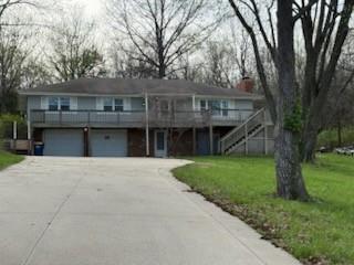 Welcome to a Lake Lotawana!!!  Best of all worlds, outer suburbs of the Kansas City area with the benefits of the Lake Life.
This is a 2nd Tier Raised Ranch Home. With a little vision and love, this 4 bedroom with 3 full bathrooms lends itself with plenty of room to accommodate a family of any size and age.  
With a footprint of almost a half-acre and a large deck on the front and the back of the house, you will find plenty of room for entertaining all year around.
Just a quick walk down to the lake, you will locate a large dock with boat lift to accommodate any of your lake living dreams.