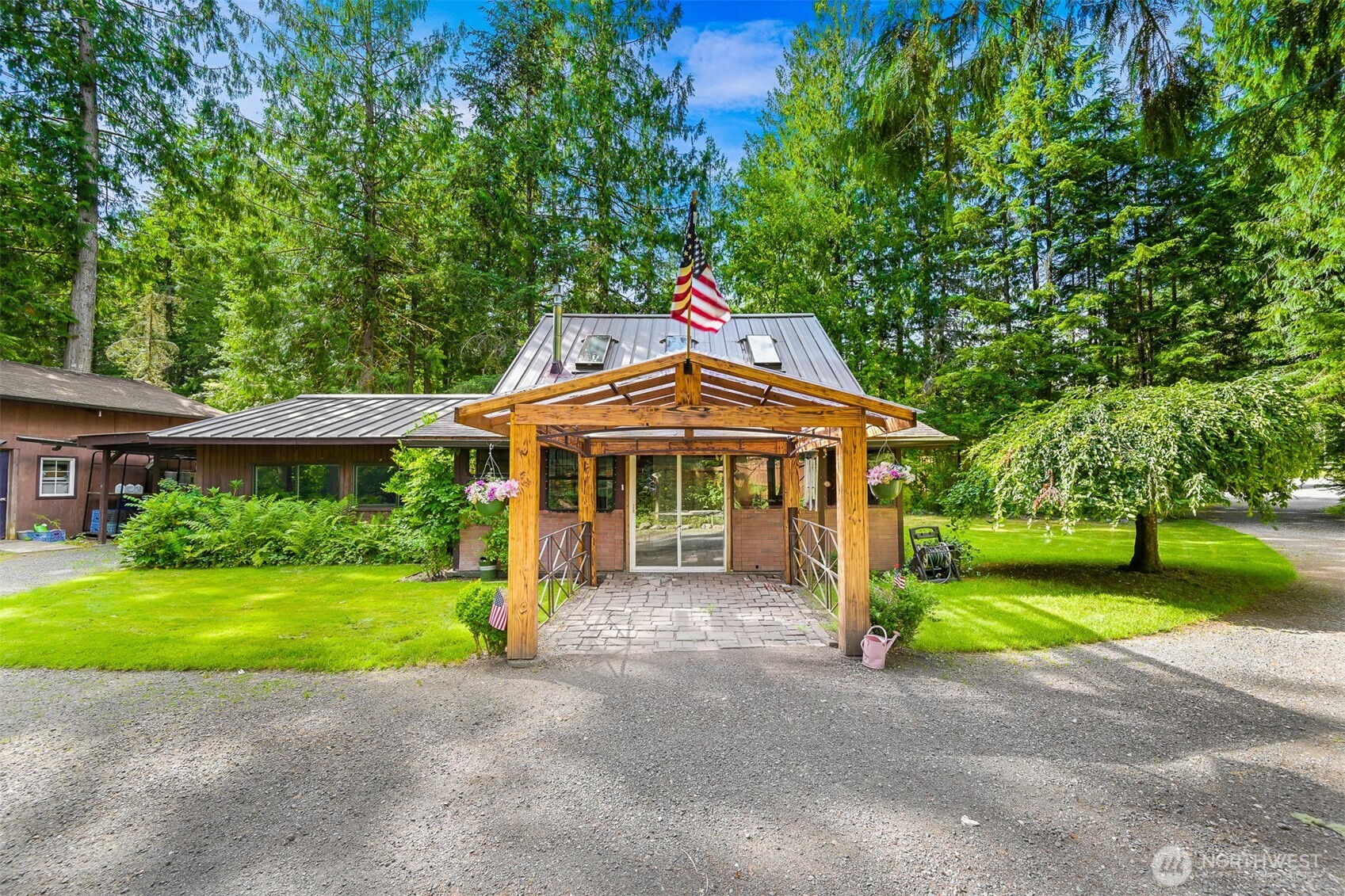 Charming 2-bed, 2-bath cabin with two bonus rooms nestled on a gorgeous, private lot near Mt. Baker! Enjoy vaulted ceilings, abundant natural light from skylights, a metal roof and a cozy gas stove that adds warmth and charm. The lofted primary suite offers a peaceful retreat, while the two bonus rooms provide flexible space for offices or small bedrooms. A standout 24x40 shop with 220V power and wood stove is perfect for hobbies or projects all year long. Peaceful setting with mountain proximity that is ideal for nature lovers, remote workers, or anyone seeking space and serenity!