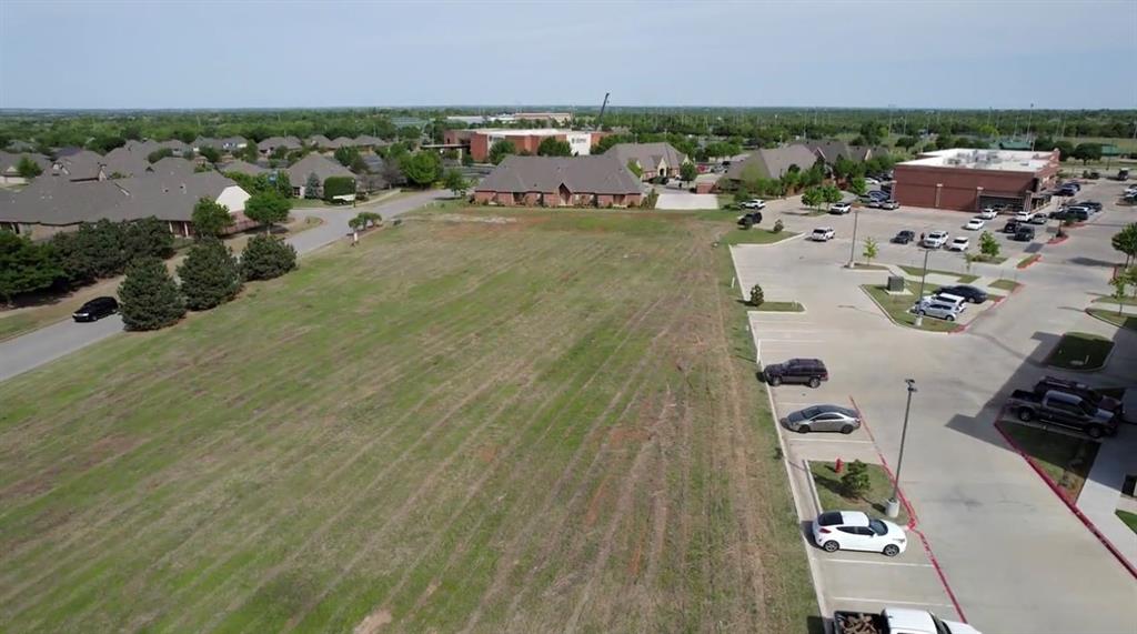 Vacant Commercial Land zoned E-2 Commercial. There are not many commercial properties left in this prime area. Water,electric, and sewer onsite. Flatand build ready. Located close to Uptown Grocery, Garage Burgers, Hunny Bunny Biscuit Company, Pepperoni Grill, Crossings Community Church, Mitch Park, Liv Medical Spa, Lowes. Easy access. The nearest interesection is Covell and Kelly, making it one of the highest ranking intersections in Edmond with 46,000 cars passingthrough daily. So many possibilities!