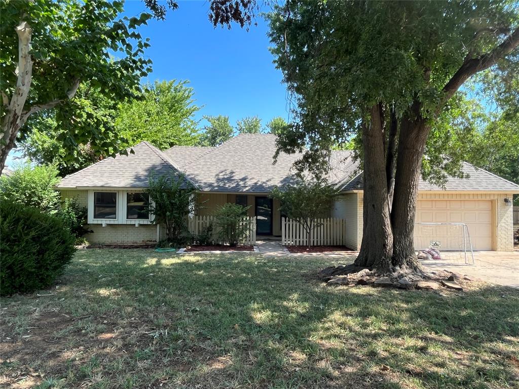 Welcome to 1313 Brookhaven Drive, located in an established neighborhood in North Edmond. This well-maintained single-level home offers 3 bedrooms, 2 full bathrooms, and 1,951 square feet (MOL) of comfortable living space on a beautiful, wooded lot. Step inside to find a bright and functional floor plan featuring an open living area with a fireplace, a kitchen with updated cabinetry, dining space, and a built-in desk area—perfect for remote work or organization. Recent upgrades include HVAC, interior paint, hot water tank, lighting, and hardware. The enclosed sunroom provides additional living space and opens to a large, private backyard—ideal for outdoor enjoyment. Additional highlights include a 2-car attached garage, window treatments, built-in appliances, security system, and inside utility room. Conveniently located near shopping, dining, and within the Edmond School District, this home combines comfort, value, and location.  Don’t miss this opportunity to own a move-in ready home in one of Edmond’s most desirable areas!