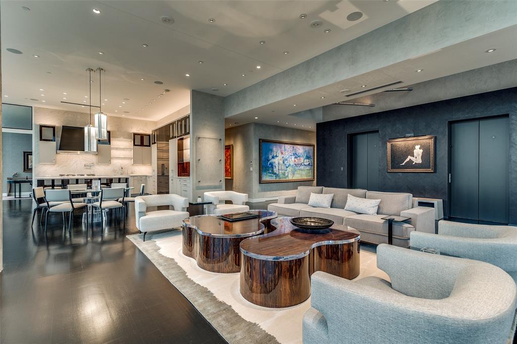 Exceptional opportunity to owh half of the top PH floor inside iconic Museum Tower.  Private and direct elevators deliver into the 30 ft tall windowed, pop up atrium accented by a custom art light installation. Thoughtful and significant finishes throughout the home include exotic Walnut, Maple and figured Eucalyptus woods, Nathan Glass Studio thick cast acid etched architectural kiln formed glass. Philip Jeffries exotic wall coverings. Quartzite stone throughout including Crystallo Wow, Calacatta Lux, Adamantium and Crytos. A custom La Cornue range and Scanomat Top brewer industrial automatic coffee system. The perfect floorplan delivers sunrise to sunset views through 12 ft floor to ceiling glass. Dual Primary baths and closets. Separate large in home Office space along with 2 detached storage areas.  3 Premier parking.