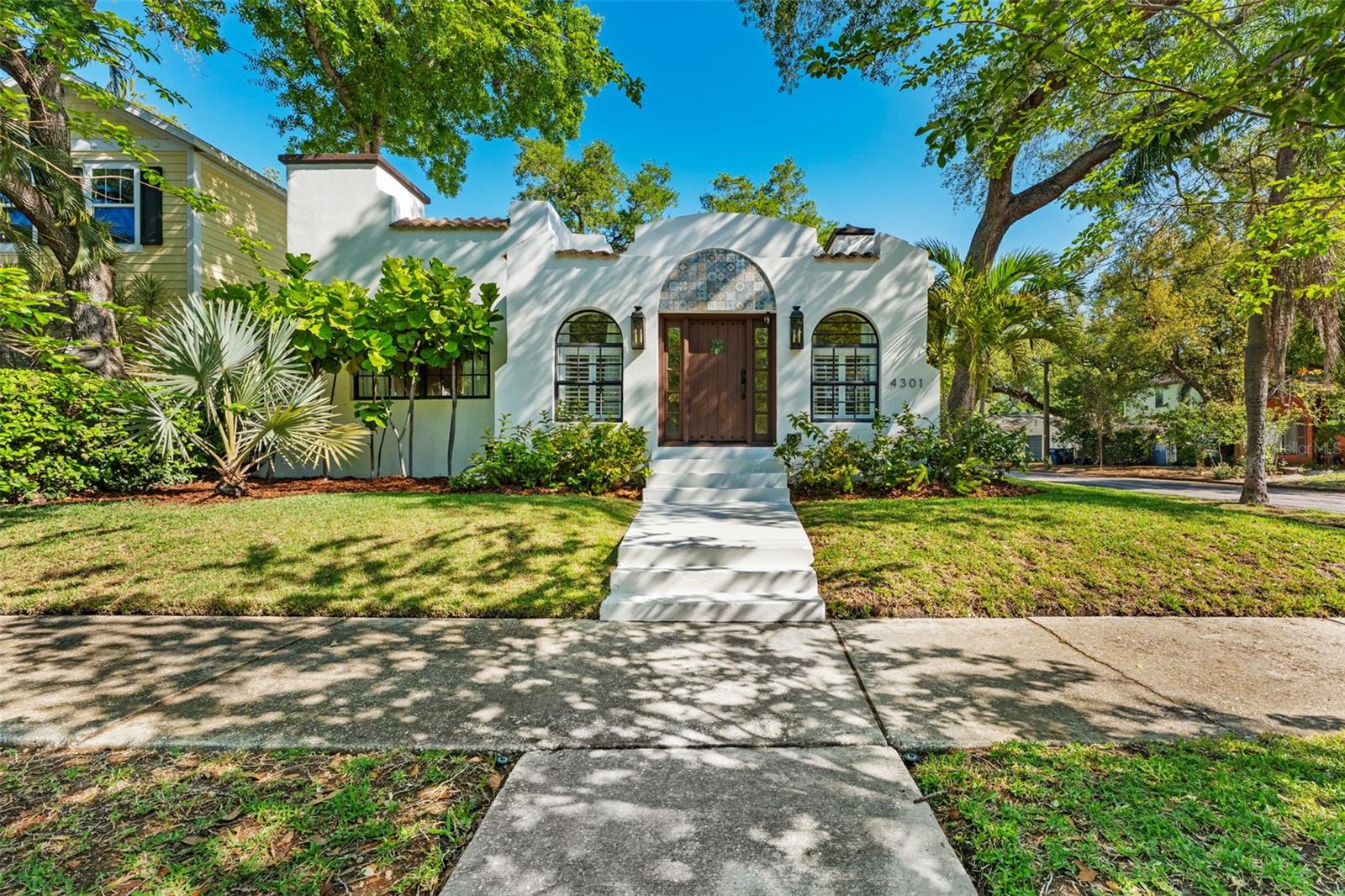 Charming 1925 Mediterranean bungalow rich in character and thoughtfully updated for modern living. This timeless South Tampa residence blends historic charm with today's most desirable upgrades, all set on a beautifully maintained corner lot in the highly sought-after Virginia Park neighborhood. Located in a non-flood zone with no history of flooding, this home offers both charm and peace of mind. Warm hardwood floors, graceful architectural lines, and abundant natural light create an inviting atmosphere.  The home features a fully renovated primary suite with a beautiful tiled walk-in shower and custom closet, along with a kitchen complete with granite countertops and newly finished cabinetry.  Step out side to a private outdoor retreat with a professionally designed paver courtyard, turf yard with putting green, and lush landscaping with lighting, ideal for relaxing or entertaining. Standout feature is the fully renovated detached garage, now a climate-controlled  flex space with hurricane impact windows, WIFI, and finished interiors, perfect for a home office, gym, or studio. Ideally located near Bayshore Blvd, Hyde Park, Downtown Tampa, Midtown, Tampa International Airport, and in the Plant school district.  Located in a non-flood zone with no history of flooding. New roof installed in 2025 and a long list of updates and improvements. Schedule your private showing today.