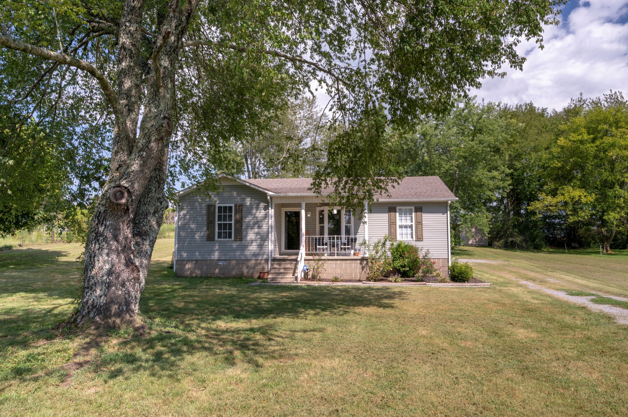 Have you been looking for the cute country house with the white picket fence? Look no further!! This is it! This cute country home has 3 bedrooms 2 baths and an open floor plan. With appliances less than two years old and updated design, this is the one you don't want to miss! Beautiful landscaping and a big yard give you plenty of room to play or sit on the porch and just watch the grass grow! A 10x10 storage shed gives even more storage. Get on out to the country!