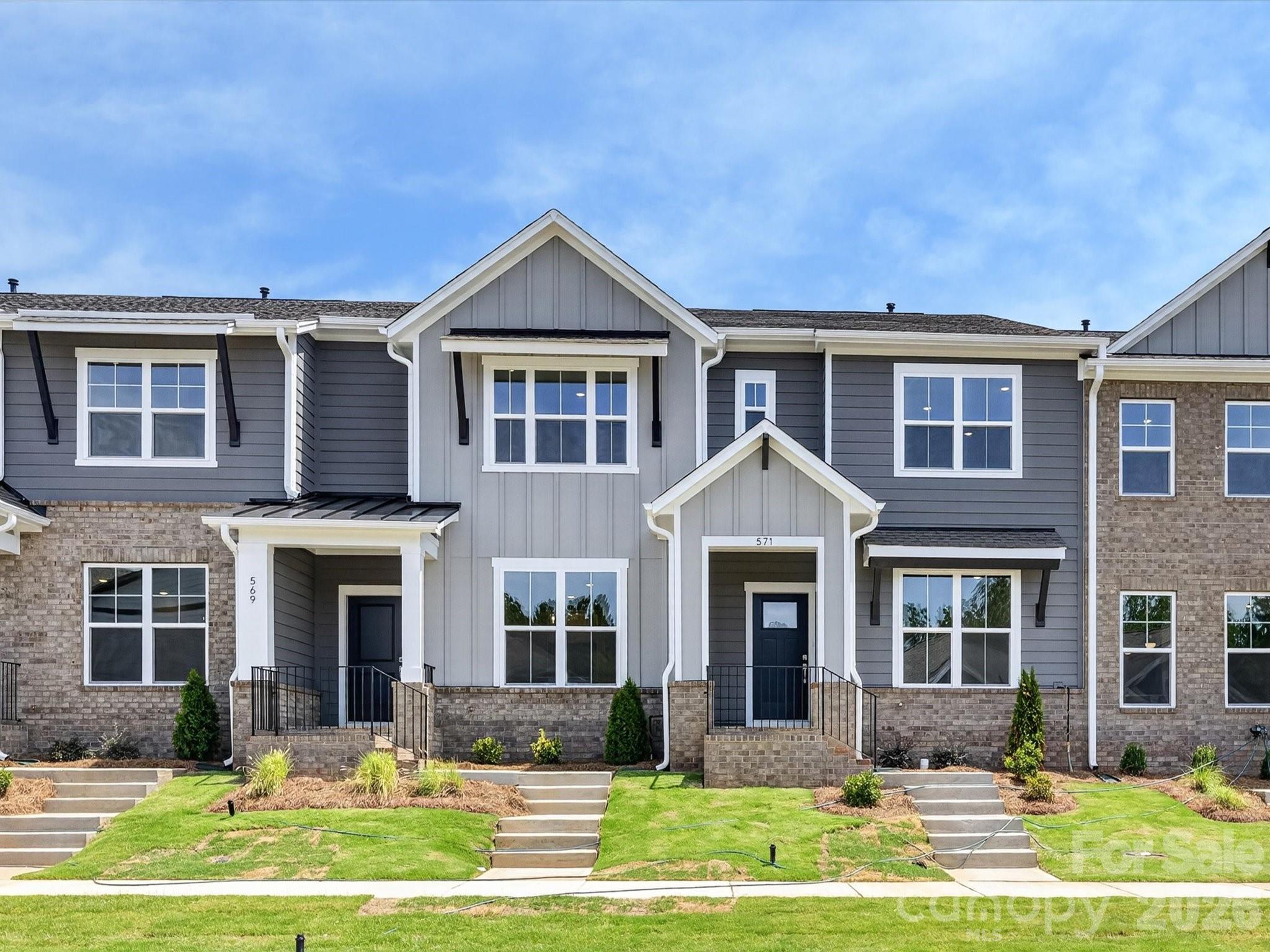 Experience a townhome that rises above the typical builder cookie-cutter style—offering fresh, modern design, quality new-construction craftsmanship, and the peace of mind that comes with great warranties and low-maintenance living. With lawn care included, you’ll have more time to enjoy the comfort and convenience this home provides.The stunning kitchen is the heart of the home, showcasing 42-inch Birch cabinets paired with elegant quartz countertops, stylish hardware, and an electric range perfect for cooking enthusiasts.Luxury vinyl plank flooring spans the entire first floor and continues up the stairs, offering durability and a seamless, upscale aesthetic. Thoughtful construction details include Hardie Plank siding and 2x6 advanced framing for enhanced strength and insulation, along with Environments for Living® Gold Standard energy efficiency to keep your home comfortable and cost-effective year-round. A spacious 2-car garage adds everyday convenience and storage.Perfectly positioned near restaurants, retail, and everyday essentials, this home offers unbeatable accessibility—and even more excitement is on the horizon with a new Target-anchored shopping complex coming to the area.A beautifully designed, energy-efficient home with minimal upkeep in a prime location—this is townhome living at its best.