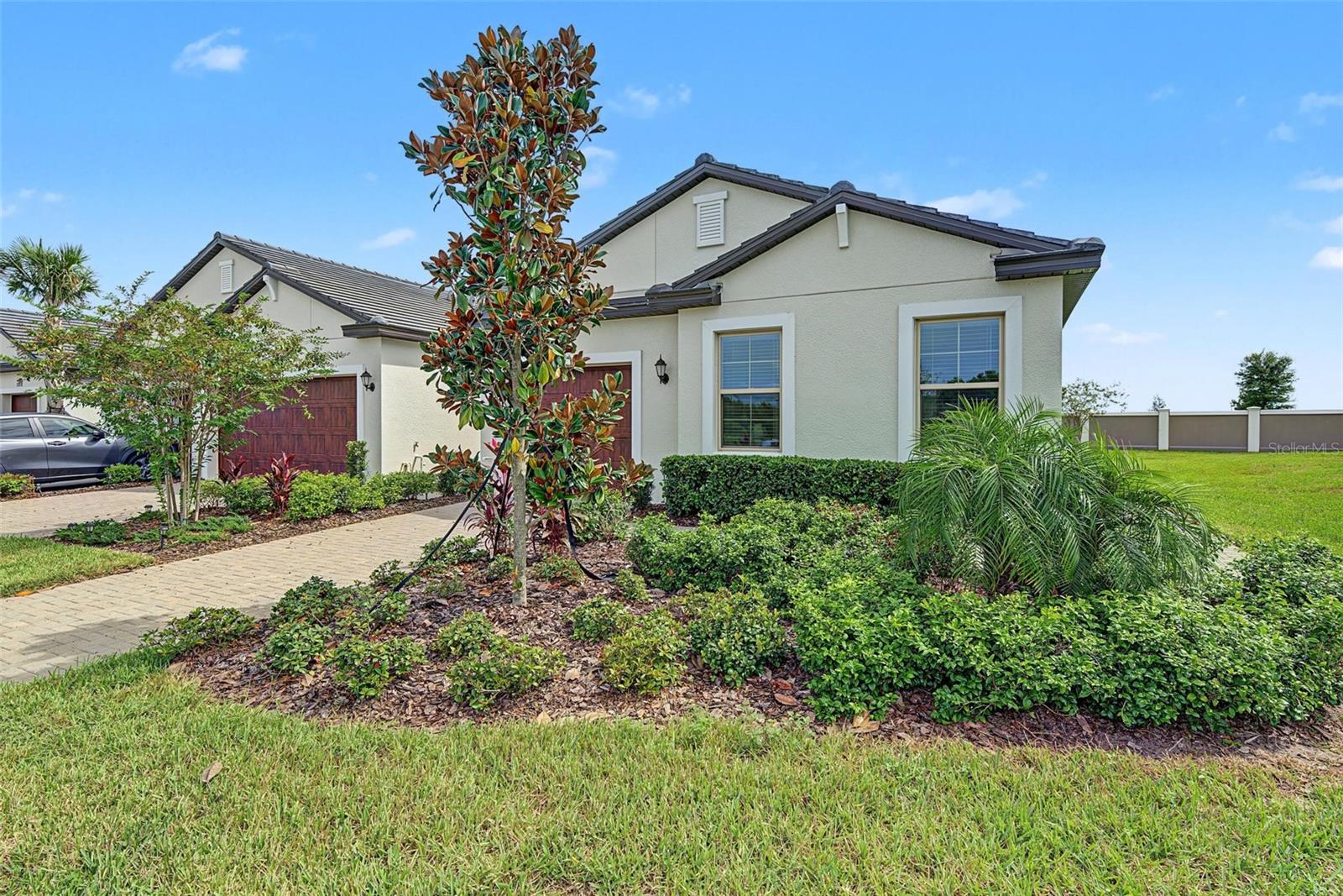 ALMOST BRAND NEW! This END UNIT Villa across the street from wonderful CONSERVATION & NO BACKYARD NEIGHBOR in Medley Active Adult. For those better than 55 years young, presents an exceptional lifestyle just beyond the confines of your home. As a resident, you'll enjoy exclusive Clubhouse access with a full calendar of events daily! You will also enjoy a restaurant & bar, heated pool w/cabanas, ballroom, billiards room, card room, state of the art fitness center, Tiki Hut, Fire Pits, pickleball & tennis courts, bocce ball, yoga, line dancing and private active adult events. PLUS included in your HOA is a 15-acre lagoon membership w/soft, sandy beaches including a swim-up bar, kayaking, paddleboarding, obstacle course, waterslides, corn hole games, and tons of community events! Be sure & invite friends or family to come along with you as you may gift them passes or pay a deeply discounted rate! There is also a BRAND NEW TIKI HUT COMING SOON along with another set of amazing amenites! This IMMACULATE villa will please even the most selective buyers! Comprised of 2 spacious bedrooms, 2 Full Baths + an office/den, and 1 car garage. Your new home includes UPGRADED TILE PLANK FLOORING THROUGHOUT. NO CARPET ANYWHERE!!! Stainless appliances and wood cabinetry AND QUARTZ COUNTERTOPS. Sliding glass doors lead to your COVERED LANAI. Great spot to sit and relax and enjoy a cup of coffee or glass of wine! As you step inside, you'll be greeted by a seamless flow of open living spaces, making it ideal for both relaxation and entertaining. Get ready to make memories that will last a lifetime! Your dream home awaits; you will be enjoying the CAREFREE FLORIDA RESORT LIFESTYLE in your new home as quickly as you are able to move in! Gorgeous curb appeal on this block villa! Enjoy 42" Cabinets, and Walk-in Pantry in this gorgeous kitchen. Primary Suite includes ensuite bath, dual sinks, and Walk-in Closet to keep you organized, and ceiling fans to keep you cool. High-speed (ULTRAFI) internet, premium cable, yard maintenance & exterior painting and homeowners' insurance for structure are covered by HOA. The location of this residence is equally remarkable, situated in close proximity to premier shopping destinations, and an array of dining options, you'll find yourself immersed in a vibrant community that strikes a perfect balance between exclusivity and convenience. Ride your Golf Cart to the Clubhouse, Publix, restaurants, Farmers Market, Chick-fil-A, Banks, Starbucks, Nail Shops, and more! Close to Advent Health Hospitals, BayCare Hospital, Florida Medical Clinic, Wire Grass Mall, Tampa Premium Outlet Mall, Krate at the Grove, Sam's Club, Costco, Golf Courses & Movie Theater. Easy access to I75, 275
