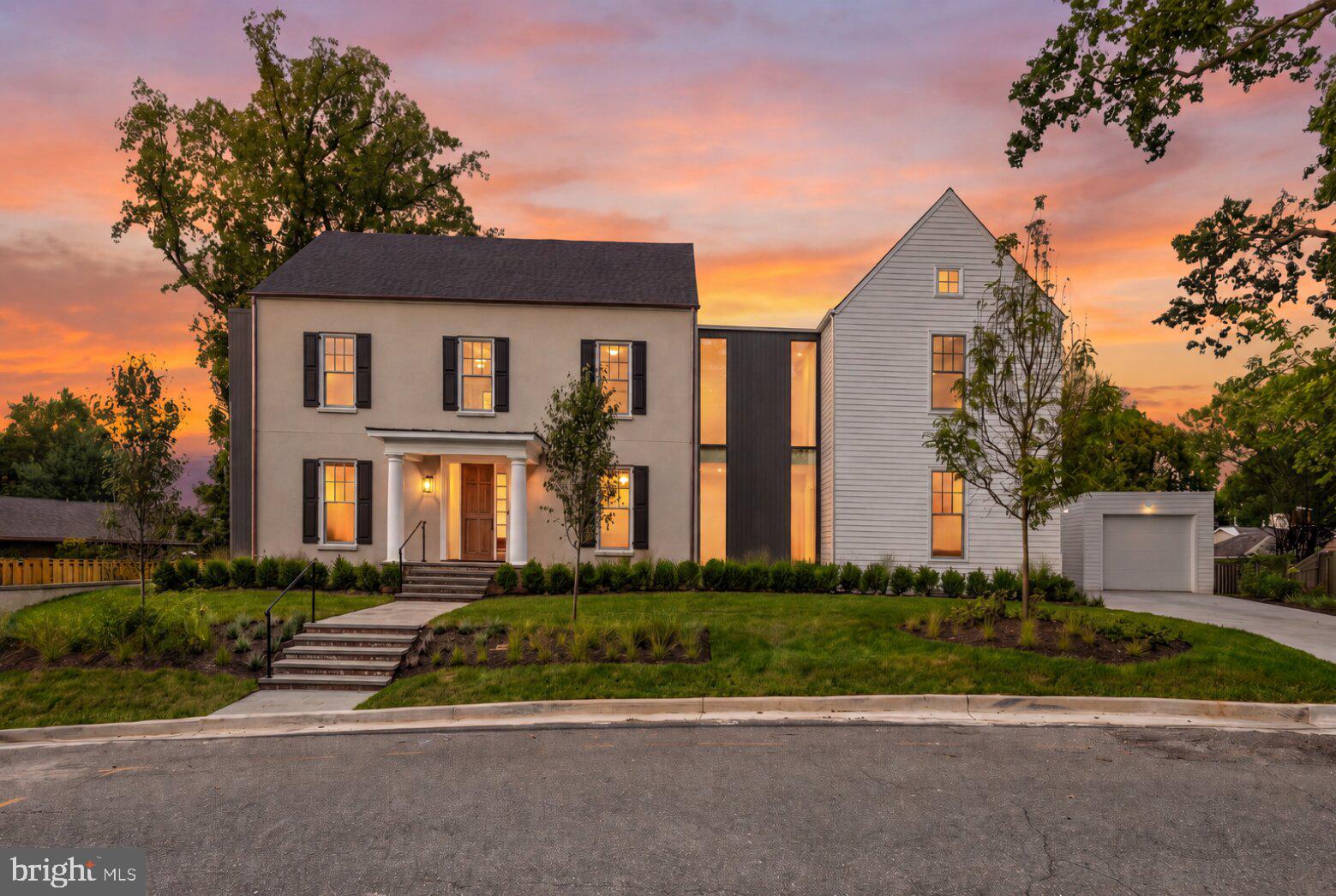 Tucked away in the coveted Whistling Pines neighborhood of Falls Church, this extraordinary custom residence offers over 5,800 square feet across four beautifully finished levels, with 6 bedrooms, 6 full baths, and 2 half baths - all less than a mile from the East Falls Church Metro, W&OD Trail, and Benjamin Banneker Park.Collaboratively designed by Architect Luther Weber, who spent 12 years working under renowned architect Hugh Newell Jacobsen, and award-winning builder GN Contracting Inc., the home pairs architectural pedigree with exceptional custom craftsmanship. Wide-plank select white oak flooring, custom millwork, architectural trim, Baldwin hardware, Grohe and Hansgrohe fixtures, custom steel rails, smart wired for home audio and carefully curated stone and tile finishes carry throughout. The home is also wired for Verizon, while hidden ceiling speakers in the dining room preserve the clean architectural aesthetic.The main level is designed for both everyday living and sophisticated entertaining. The showpiece gourmet kitchen features custom cabinetry, floor-to-ceiling pantry storage, a 48-inch Sub-Zero refrigerator, AGA Mercury gas range, Miele dishwasher, Sharp drawer microwave, Zephyr beverage refrigerator, under-cabinet lighting, and a massive island with storage on all sides with a dramatic black quartz waterfall edged countertop. A secondary sink including instant hot and filtered water as well as a coffee bar inspired nook add even more function. The island design offers a stool seating option as well.  The open floorplan includes a formal dining area, separate breakfast or sitting nook, and expansive living room anchored by a full masonry fireplace built with reclaimed brick from the original home and designed for either wood-burning or gas use. A large rear deck extends the living space outdoors. The main level also includes a refined powder room, a bedroom (or office) with deck access and en-suite bath.Upstairs, two secondary bedrooms each offer en-suite baths, while a spacious laundry room features a full-sized Whirlpool washer and dryer, stainless steel utility sink, storage cabinetry, and quartz work surface. A reading nook leads to the private primary suite, where three pendant lights, two closets, and a spectacular spa-inspired bath create a true retreat. The bath includes a dual vanity, deep soaking tub, open shower, Washlet bidet toilet, heated tile flooring and an oversized custom walk-in closet with built-in drawers, lots of shelving as well as dedicated shoe and bag display shelves.The 3rd level offers another bedroom, a full bath with slate flooring and walk-in shower, two large storage closets, and the option to create a private deck.The walkout lower level is built for entertaining, with porcelain tile flooring, recessed lighting, a spacious recreation room, wet bar with mini refrigerator, powder room, and a 2nd full masonry fireplace.  The room is pre-wired for a television. A temperature-controlled wine cellar with a CellarPro unit adds another luxury touch. A private lower-level bedroom features engineered white oak flooring, a built-in bookcase, walk-in closet, and an en-suite bath with walk-in shower.Additional highlights include a 2-car garage with convenient side-door access leading to the kitchen, copper gutters on the home's facade, three-zone Carrier HVAC, and dual water heaters. Thoughtfully designed from top to bottom, this exceptional residence blends striking architecture, enduring quality, and modern comfort in one of Falls Church's most desirable locations.