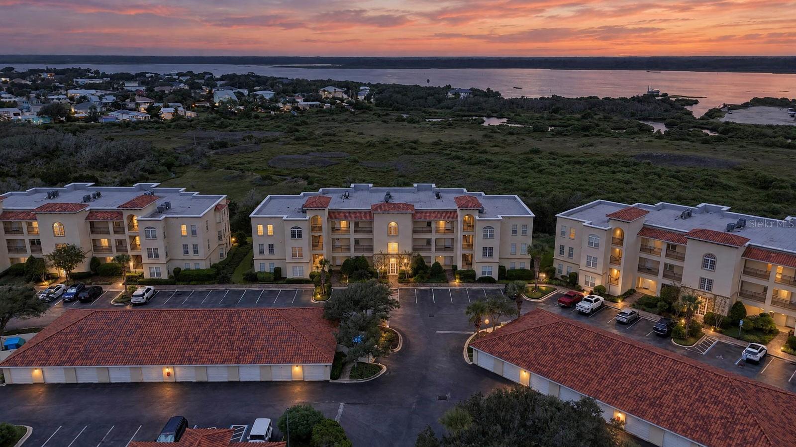 **WATERFRONT LIVING WITH VIRTUALLY MAINTENANCE-FREE CONVENIENCE!** Welcome to Unit 3305 at The Estuaries, a coveted TOP-FLOOR CORNER UNIT offering 1,650 square feet of beautiful living space, unobstructed Intracoastal views, and a lifestyle that is hard to beat! With no neighbors above and an HOA that covers hazard and flood insurance, water, trash, security, pest control, and grounds maintenance, you can spend less time worrying about upkeep and more time enjoying everything coastal living has to give.From the moment you enter this freshly painted residence, you'll appreciate the exceptionally high ceilings, abundant natural light, and spacious layout that give this condo the feel of a single-family home. Beautiful tile flooring flows throughout, complemented by custom plantation shutters, custom cabinetry, and stunning leathered granite countertops. The gourmet kitchen features a brand-new refrigerator and opens into an inviting living and dining area designed to take full advantage of the spectacular waterfront setting. An energy-efficient tankless water heater adds another level of convenience and efficiency.The spacious primary suite is a retreat of its own, featuring breathtaking Intracoastal views, private access to the balcony, an ensuite bathroom, and custom dual closets. The secondary bedrooms are thoughtfully positioned away from the main living space, providing additional privacy.Imagine starting your mornings watching the sunrise over the Intracoastal and ending your evenings with your favorite drink from the bar just off the dining area as sailboats and yachts pass by. With unobstructed water views and natural light pouring into the home, every day feels like a getaway.**AND THE LIFESTYLE EXTENDS WELL BEYOND YOUR FRONT DOOR!** Enjoy complimentary boat and RV storage, along with an additional dedicated garage spacious enough to accommodate a full-size sedan, a 16-foot boat, or additional storage. A nearby public boat ramp makes getting out on the water convenient, while beach access directly across the street means the sand and surf are never far away.Even better, **ALL APPLIANCES, ALL TELEVISIONS, AND PATIO FURNITURE CONVEY WITH THE PROPERTY!** With fresh interior paint, a brand-new refrigerator, custom finishes, and so many inclusions, settling into your new waterfront lifestyle couldn't be easier.Whether you're searching for a primary residence or a coastal retreat, Unit 3305 offers an exceptional opportunity to enjoy the best of St. Augustine's waterfront lifestyle. **The biggest decision of your day might just be whether to take the boat out or head to the beach!** Living at The Estuaries isn't just about owning a waterfront condo. It's about enjoying the lifestyle that comes with it.