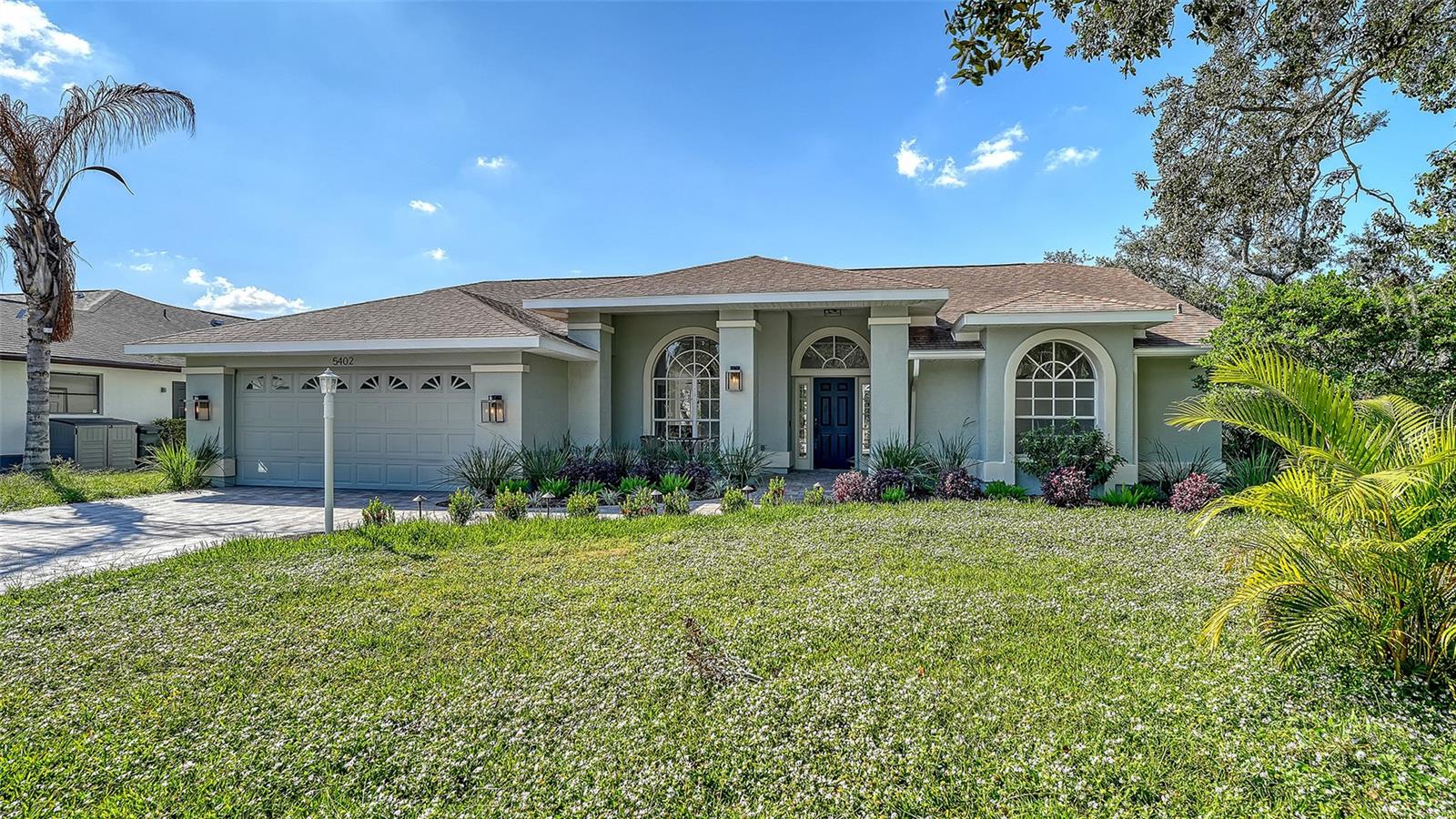 TOTALLY UPDATED POOL HOME WITH BOAT LIFT AND GULF ACCESS. This is your chance to live in a great home on the water without being in a flood zone. This is X flood zone. No flood insurance required. This 3 bedroom 2 bath home has all new LVP flooring, kitchen, bathrooms, appliances, fixtures, trim, paint, outdoor kitchen and paver driveway. All cabinetry is dove tail with soft close feature, and all counters are quartz. The floor plan is spacious, bright and open with high ceilings, huge windows, and a wood burning fireplace that is shared between the family room and the 3rd bedroom or den. The open kitchen is amazing and overlooks the family room. The living room, family room and primary bedroom all have large windows and sliders leading to the screened and covered lanai and pool. The outdoor living space is beautiful and tranquil with an awesome view of your shade trees, dock and river. Enjoy watching the visiting Manatee, jumping Mullet, and rolling Tarpon from your updated dock. After boating for the day, you can lift your boat out of the water, jump in the pool, and cook the catch of the day at your amazing outdoor kitchen. Then have a cocktail and watch a beautiful sunset from your shaded deck. River Landings also has a community pool and dock, and is only a few miles to I-75. Low HOA and no CDD fee. This location is convenient to Lakewood Ranch, UTC Mall, Sarasota, Bradenton, restaurants, shopping, and golf. This home is great for entertaining and enjoying the Florida lifestyle.