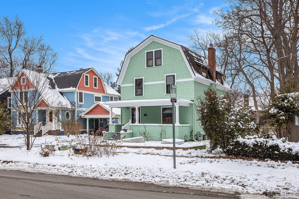 Discover the perfect blend of character, comfort, and convenience in this charming 3-story Dutch Colonial Revival nestled in the highly sought-after Burns Park neighborhood - just one block from Burns Park Elementary and minutes from UM Central Campus and downtown Ann Arbor. A cheerful freshly painted exterior and inviting covered front porch set the tone for the warmth and personality found throughout. Step inside to appreciate the original front door, rich wood floors, and thoughtful updates that enhance the home's historic appeal. The main level features a sun-filled living room with gas fireplace, a formal dining room with French doors to the Trex deck, and a renovated kitchen boasting shaker-style cabinets, concrete counters, and a cozy breakfast nook. A convenient half bath completes this level. Upstairs, you'll find two sizable bedrooms with generous closets, including a luxurious primary suite with a private bathroom offering an oversized vanity, freestanding soaking tub, andseparate shower. The second bedroom enjoys its own nearby full bath, and a hallway walk-in closet provides ample linen storage. The finished third floor offers tremendous flexibility with a spacious family room and adjoining bedroom - ideal as a second primary bedroom with glam closet, work-from-home space, hobby area, or the ultimate playroom. A full basement provides laundry, utilities, and future finishing potential. Outside, the fenced backyard is perfect for pets and play, and the two-car detached garage offers year-round vehicle protection and additional storage. Completely move-in ready with room to personalize over time, this home delivers the quintessential Ann Arbor lifestyle. Walk to parks, caf??s, cultural destinations, and everyday conveniences - a location rated very walkable, very bikeable, and transit-friendly by WalkScore.com. Don't miss the incredible opportunity to put down roots in this coveted neighborhood in the heart of Ann Arbor! Home Energy Score of 1. Download report at osi.a2gov.org/herd.