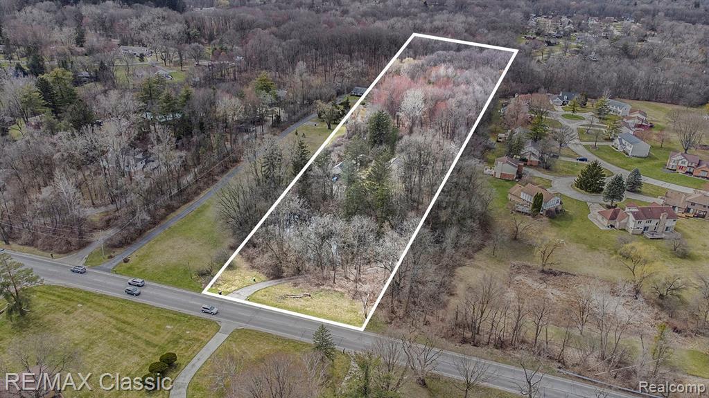 A RARE FIND 5.91 ACRES, ATTENTION ALL RESIDENTIAL BUILDERS AND INVESTORS HERE IS YOUR OPPORTUNITY FOR NEW CONSTRUCTION TO BUILD NINE (9) HOMES ON THIS PRIVATE WOODED LOT WITH A SMALL POND TOWARDS THE FRONT OF THE PROPERTY.  ORIGINAL SITE PLAN AND SURVEY ATTACHED WERE COMPLETED AND APPROVED BY THE CITY OF FARMINGTON HILLS IN  2006.  TWO LOTS WHICH INCLUDE SIDWELL Property ID: 2325426001 (5 ACRES) + Property ID: 2325426002  (0.91 ) ACRES WHICH IS A SERENE PEACEFUL UP-NORTH SETTING WHICH IS A TOTAL OF 5.91 ACRES COMBINED. HOOK-UP TO CITY WATER AND CITY SEWER AVAILABLE AT THE STREET.  VALUE IS IN THE LAND AND THE EXISTING HOME IS A PLUS AND THE HOME NEEDS UPDATING AND HAS 3 BEDROOM AND 3 BATHROOMS. 2.5 CAR GARAGE WITH AMPLE STORAGE AND SEPARATE BUILDING NOT COMPLETE, AWARD WINING FARMINGTON SCHOOLS. IF YOU’RE LOOKING FOR NATURE AND SECLUSION BUT WOULD LIKE TO BE NEAR ALL MAJOR CONVENIENCES AND ROADWAYS, THIS IS THE PROPERTY FOR YOU. PROPERTY IS BEING SOLD AS-IS. SELLER MAY ALLOW WEEKEND SHOWING FOR ONLY SERIOUS PRE-APPROVED BUYERS MUST SEND PRE-APPROVAL/ PROOF OF FUNDS PRIOR TO MAKING A INTERIOR SHOWING APPOINTMENT.  PRIVATE PROPERTY SO ALL VIEWING OF PROPERTY MUST HAVE CONFIRMATION OF THE TIME TO SHOW.