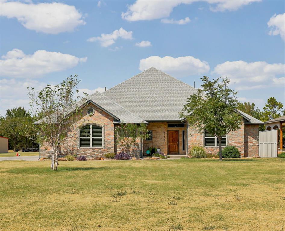 Welcome to 317 SE 97th St, offering the perfect combination of space, versatility, and outdoor living on 1.2 acres. This impressive home features 3 bedrooms, 2 full bathrooms, 1 half bath, and a 3-car garage.Inside, a spacious living room offers ample space to gather and entertain. Upstairs, the large bonus room offers endless possibilities for a game room, media room, or additional living space and is already plumbed for a wet bar. With a full bathroom upstairs, the space is even more functional for guests and entertaining. The backyard is made for enjoying Oklahoma summers, featuring an in-ground pool, hot tub, and outdoor kitchen with plenty of room to relax and host family and friends. With 1.2 acres, multiple entertaining spaces, a 3-car garage, and resort-style outdoor amenities, and room for a shop this property offers room to spread out both inside and out. Schedule your private showing today!
