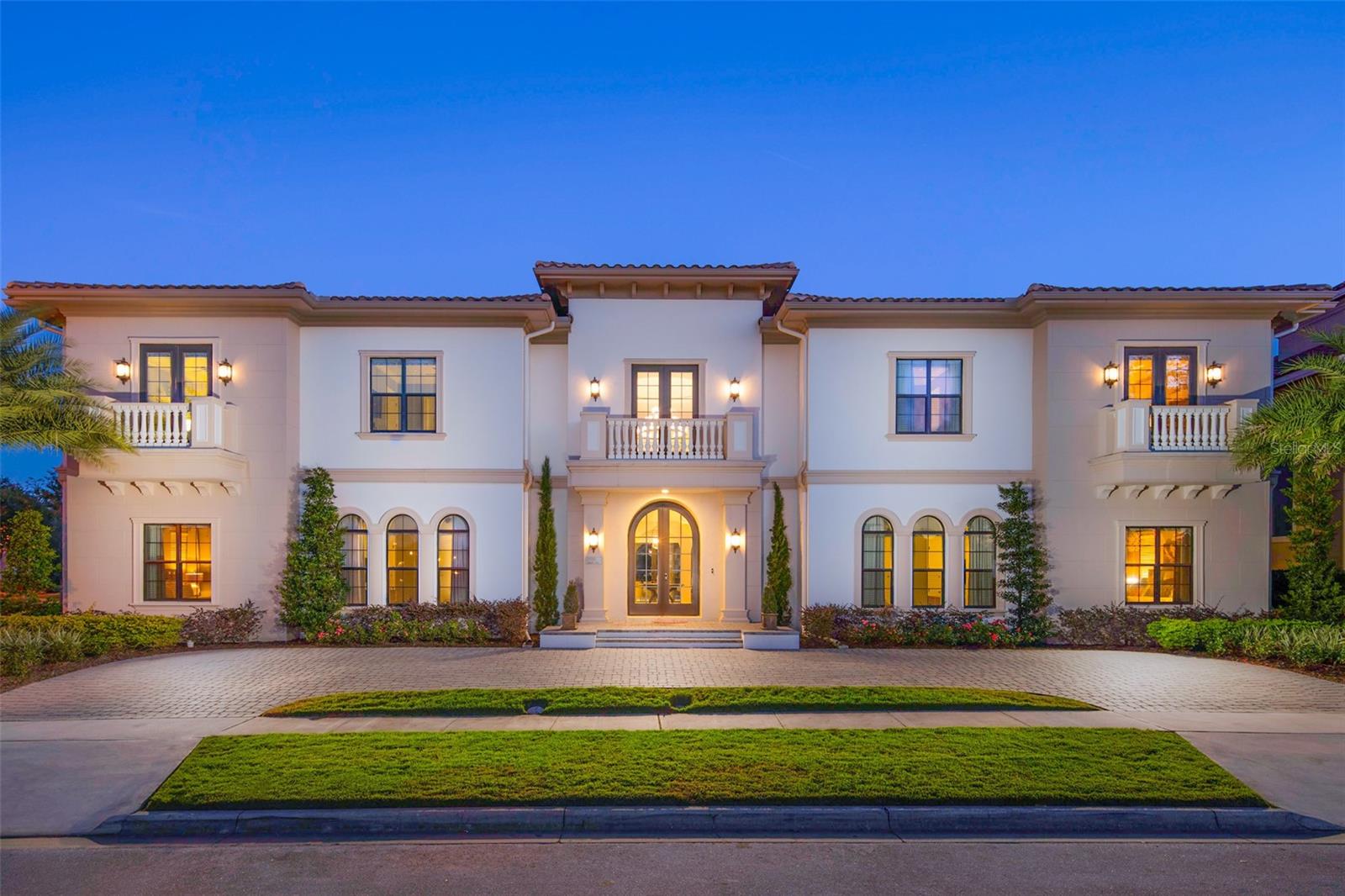 Big Price Improvement, Act Fast. One of the largest homes in Reunion Resort on a rare double lot overlooking the 8th hole of the Tom Watson golf course. This custom luxury home is well established in a rental program with repeat guests and future bookings in place. 

Designed for large multi-generation family reunions, prepare home-cooked meals in the fully equipped gourmet kitchen, or a barbecue in the summer kitchen. Swim in the pool, watch a movie in the home theater, nap in a themed bedroom, or play hours of arcade machines and games.

A stunning double staircase welcomes you to this incredible one-of-a-kind home. With a large open plan living room, summer kitchen, and covered lanai, there are plenty of spaces to relax and socialize. Experience luxury with a large private pool with spillover spa, sun shelf, and oversized patio. The home also features two additional gathering areas upstairs, a home theater and game room, and two themed bedrooms. The large balcony overlooking the golf course features 6 TVs to enjoy sports games, a pool table, ceiling fans, and plenty of seating.

This one-of-a-kind home also attracts corporate retreat bookings, as it's the perfect setting for company gatherings, executive meetings, training & team building. Guest can utilize the secondary catering kitchen and enjoy meals & snacks in the dining/conference room, covered lanai, or summer kitchen. The dining/conference room has a large table with seating for 32, the ideal setting for meetings. The theater room with a projector screen can be utilized to conduct a presentation or training session. Hold business meetings in the day, then entertain in the evenings.

The rear pool deck is over 120 ft wide, it features a huge 35 x 16 ft pool, of which the depth ranges from 3ft to 5ft. On either side of the pool, there is a large 10.5 x 6.5 ft spillover spa and 10 x 8 ft shallow splash area that is 6 inches deep to enjoy.

Located just 6 miles from Walt Disney World and other theme parks. The home has an active resort membership offering access to Reunion Resort's world-class amenities, including three championship golf courses designed by Palmer, Watson, and Nicklaus. There is also tennis courts, fitness gym, mini golf, multiple pools and a 5 acre waterpark with lazy river, along with great dining options.