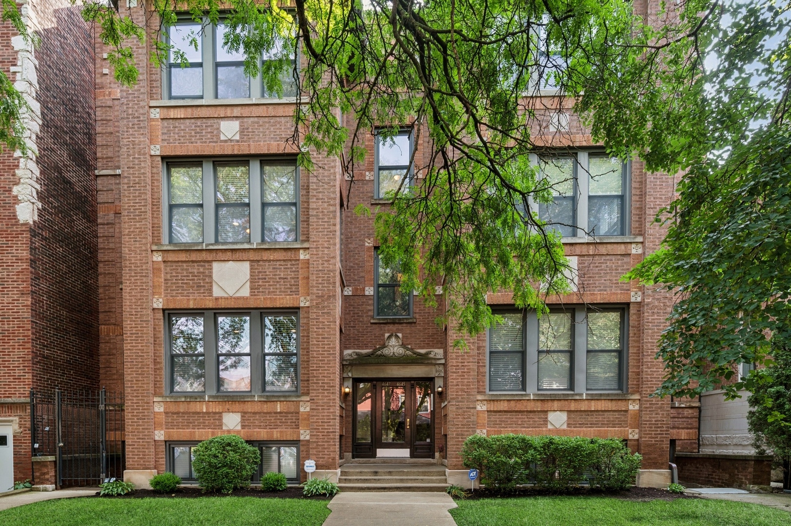 Fantastic location in the heart of Ravenswood/Lincoln Square! This stunning walk-up condo offers serene treetop views from the third and top floor on an extra-deep lot. The 2 bedroom/2 bath condo has a bright sunroom and a fabulous chef's kitchen. Loaded with modern charm and architectural character, you will find custom built-ins, soaring 11-foot ceilings, wood burning fireplace with gas starter, cherry hardwood floors, and exposed brick interior walls. The newly renovated kitchen boasts custom cabinets, honed quartzite countertops, marble backsplash, designer lighting, exterior vent hood, stainless steel appliances, large breakfast bar, garden window and wine fridge. Double doors open to the spacious primary bedroom with a walk-in closet and en-suite bath, complete with luminous skylight, double sinks with granite countertops, updated exhaust fan, new fixtures, and walk-in stone shower with bench. The second bedroom is perfect for your guests or as an office. The second bath features a tub/stone shower combo with granite countertops, updated exhaust fan, new fixtures, and convenient storage closet. Additional highlights include a newer full-size LG stacked washer/dryer, deeded garage parking space, and ample permitted street parking. Recent improvements since 2020 include nearly all new appliances, fresh paint, and brand-new HVAC system (2025) with Nest thermostat. The full-width rear deck offers generous space for grilling, entertaining, and enjoying summer evenings - plus the occasional views of the Air and Water show, 4th of July fireworks and even the Northern Lights when visible! Did we mention the unbeatable location? Just steps to the Damen Brown Line, 1.5 blocks to the Ravenswood Metra, LA Fitness, Mariano's and easy walks to abundant shopping, dining, nightlife, breweries (Malt Row), distilleries, festivals and gyms along the Damen, Montrose, and Ravenswood corridors. You'll also be near vibrant Lincoln Square, Andersonville, Northcenter, Uptown and Lakeview. This Ravenswood gem truly has it all - style, comfort, and prime location. Be sure to check the Info Sheet under the drop-down box for more highlights and updates. Come see this beautiful home!  ***The written offers have begun coming in as of last night. Please submit your highest and best offer by 7pm tonight. If you have submitted an offer and would like to improve your offer, please do so by 7pm tonight, Monday, August 25. Thank you and any questions, please call Laurie.***