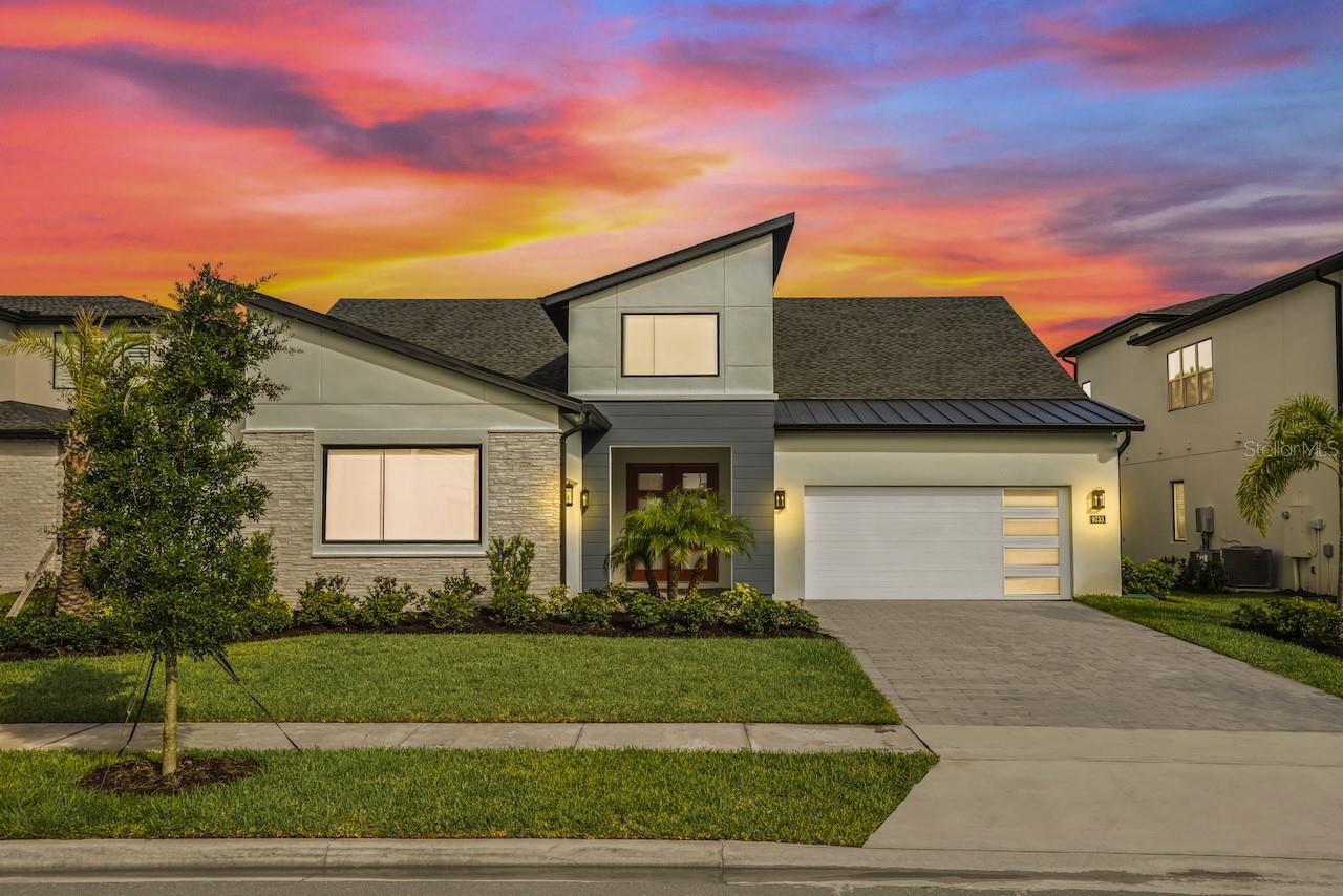 Welcome to the Bordeaux Modern, a striking contemporary one-story residence located in the private community of Laurel Pointe, Toll Brother’s new and gated neighborhood with only 124 homes. Completely sold out with construction complete, this home represents a great opportunity to own in one of Lake Nona’s most sought-after communities.  This home is exceptionally rare—one of only two single-story Bordeaux floor plans in the 70' Collage Collection across the entire Laurel Pointe community.

This thoughtfully designed four bedroom, four bathroom home spans nearly 3,000 square feet of luxury living space on a generous .23-acre lot. The bold modern elevation and clean architectural lines make a stunning first impression. Inside, soaring ceilings, sleek tile floors, and an open-concept design create a perfect balance of style and comfort.
The heart of the home features a chef’s kitchen with an oversized waterfall island, walk-in pantry, custom cabinetry, and premium appliances, flowing seamlessly into the casual dining space and expansive great room with a dramatic feature wall. Walls of glass frame the private conservation view and open to the covered lanai, offering the ideal setting for indoor-outdoor entertaining. The oversized backyard provides plenty of room to design your own pool and backyard oasis.
The primary suite is a serene retreat with tray ceilings, large windows overlooking the conservation, a spa-inspired bathroom with dual vanities, a free-standing tub, an oversized shower with designer tile, and a spacious walk-in closet. Three additional bedrooms each include walk-in closets and access to full baths, while a versatile flex room provides the perfect space for a home office, media lounge, or playroom.
Additional highlights include a split three car garage, and energy-efficient construction with designer finishes throughout. As a Laurel Pointe homeowner, you will also enjoy full access to Laureate Park’s amenities, including LP Fit fitness center, resort-style pools, playgrounds, and miles of trails. Lake Nona’s Town Center, Medical City, and top-rated schools are just minutes away.