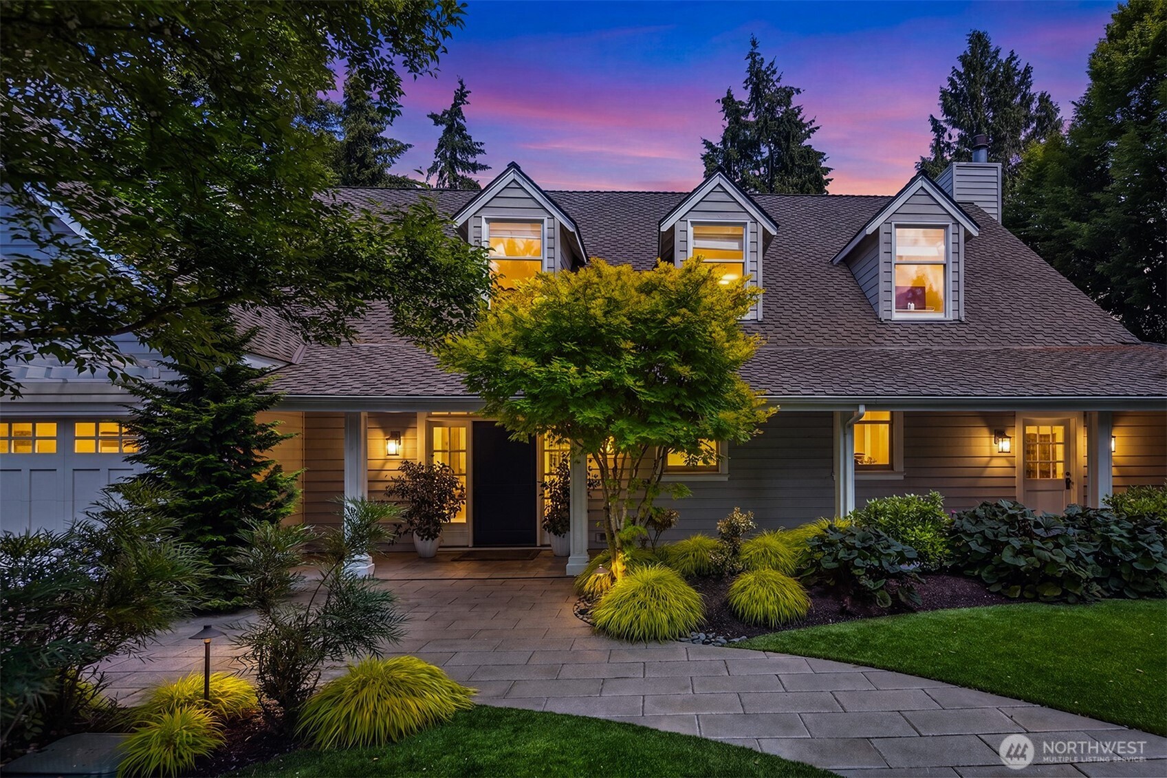 Exterior highlights the home's classic shingle-style charm