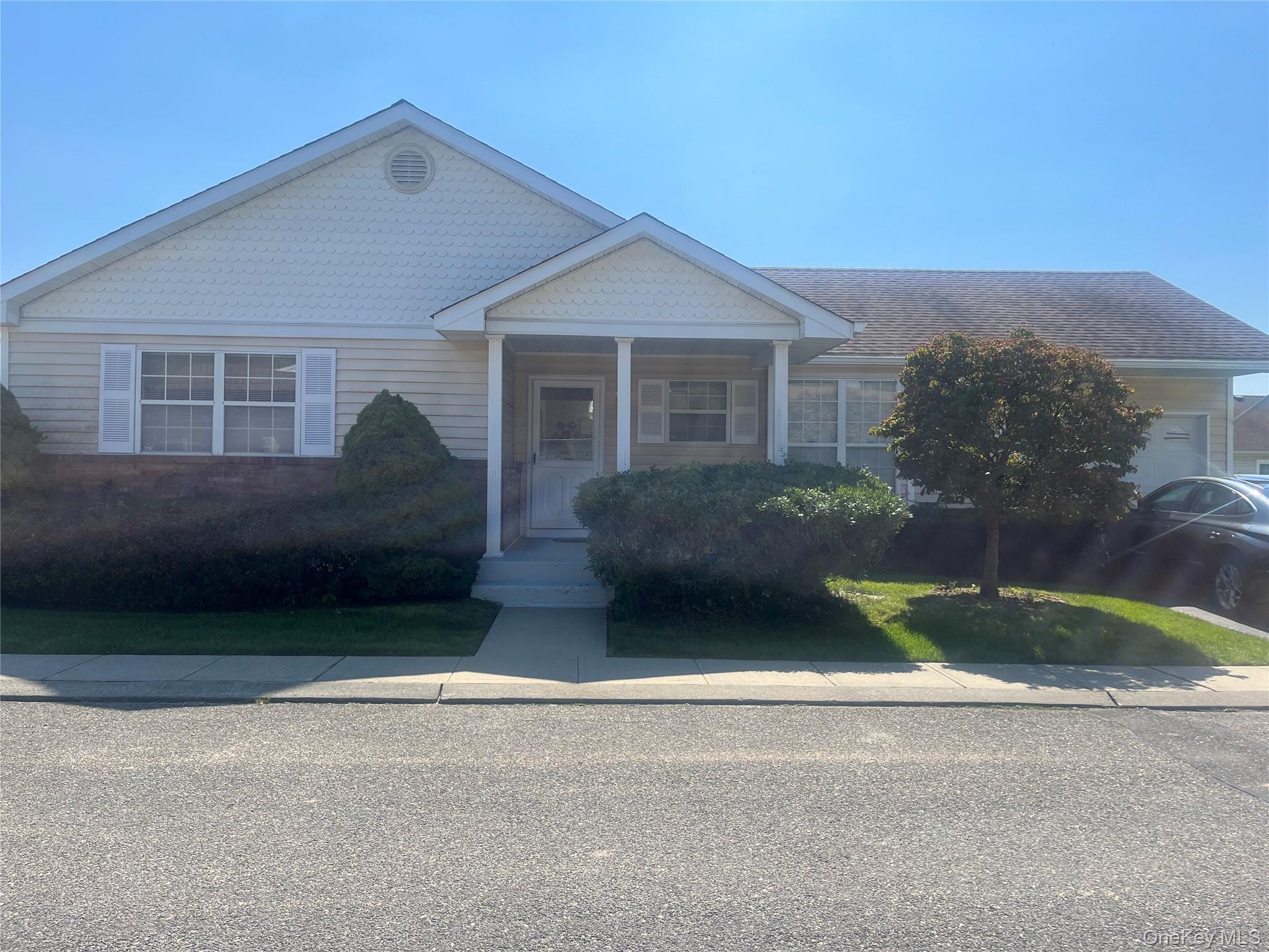 18 Dawn Drive, Oakdale, NY — Windmill Gate 55+ Community

Welcome to Windmill Gate, a gated, low-maintenance 55+ community of just 110 homes, built between 1989 and 1991. Here you’ll find a wonderful blend of privacy, amenities, and community spirit in East Long Island.

This inviting 2-bedroom, 2-bath ranch includes the signature features you’d expect in Windmill Gate — vaulted ceilings, bright spaces, and a 1-car attached garage. The home’s living room is illuminated by a beautiful skylight, enhancing the open, airy feeling. The layout flows into a formal dining area and a well-equipped kitchen with abundant cabinetry. The primary suite boasts an en-suite bath and generous closet space, while the second bedroom is ideal for guests or a cozy home office.

Additional comforts include central air, in-home laundry, and a private patio for relaxing or entertaining outdoors without maintenance worries.

As a resident of Windmill Gate, you have access to a clubhouse / amenity center that features a fitness room, billiards, multipurpose and meeting rooms, sauna / steam rooms, and outdoor pool, patio, and gazebo. This is a community built for connection — neighbors gather regularly for social events, clubs, and casual afternoons by the pool.

Located just moments from Nicoll Bay and Heckscher State Park, and minutes from local dining, shopping on Sunrise Highway, and Long Island MacArthur Airport (˜12 minutes), Windmill Gate also offers good access to NYC for day trips or commuting.

Don’t miss the chance to live in this rare gem — schedule your private tour today and experience the charm and lifestyle of 18 Dawn Drive in Windmill Gate.