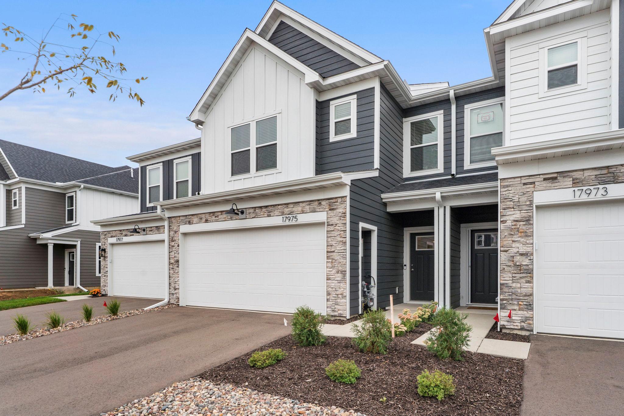 Welcome to this beautifully maintained three-bedroom, three-bathroom townhome in Lakeville, built in 2026 with a clean, modern layout throughout. Just off Interstate 35, the location offers convenient access to downtown Minneapolis, downtown St. Paul, and MSP International Airport, each 20 to 30 minutes away, with quality craftsmanship evident from the moment you step inside.The main level features an open sightline into the living area, 9-foot ceilings, and abundant natural light throughout the day. A powder bathroom, coat closet, and direct access to the attached two-car garage add everyday convenience, and a nook off the garage entry offers the opportunity for a built-in bench or locker system as a functional mudroom.The open-concept living area flows easily between the living room, dining area, and kitchen, with 9-foot ceilings and natural light carrying throughout. The dining area offers flexibility for furniture arrangements and opens directly to the concrete patio, with peaceful views of the backyard and pond ideal for morning coffee or evening relaxation. The kitchen features an oversized center island with additional counter space and seating, a closet pantry, stainless steel appliances, and a gas range, with a large picture window above the sink framing views of the backyard and pond.Upstairs, three bedrooms include a spacious primary suite along with bedrooms two and three, each offering natural light and generous closet space, plus a full bathroom and additional hallway storage. The primary suite offers peaceful views of the backyard and pond, abundant natural light, and a walk-in closet, with a private 3/4 bathroom featuring a double-sink vanity, walk-in shower, linen closet, and second walk-in closet.Move-in ready with a neutral aesthetic, this Lakeville townhome offers an easy foundation to make the space your own, close to shopping, dining, and outdoor recreation.