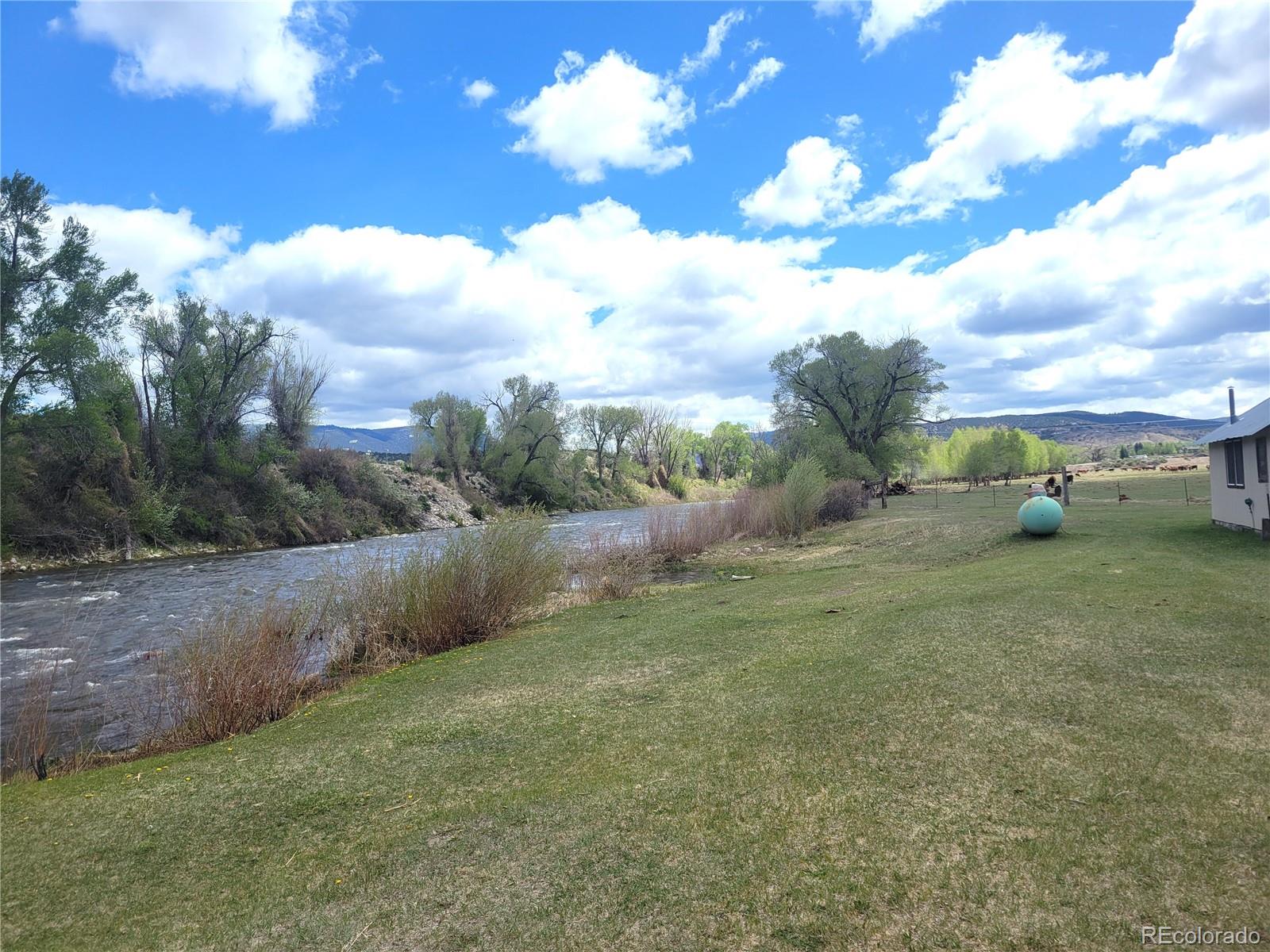 Welcome to the Seago Development Ranch.  This amazing property consists of 35 fully usable acres and boasts more than 1,800 feet of Eagle River frontage.  The Ranch includes a senior water right of .75 CFS for irrigating the 25 acres that are currently used for pasture.   There is no property in the area that would be better for a new development or a private luxury ranch.
Come see the Seago Development Ranch and experience the privacy that is not normally found on the edge of a resort town.  With more than 35 acres of land, you can let your imagination run wild.  This property abuts the town of Eagle, providing potential for water and sewer services, as well as a nearby natural gas pipeline.  Additionally, the property has been included in the Town of Eagle’s Comprehensive Plan so the development opportunity is obvious. If you are looking for a property to develop into the next exclusive community, or you want to build your dream home on the river with plenty of room to breathe, this is it.  There are no covenants on this property so you can decide if you want to be part of the City of Eagle or remain in the County.  If you are seeking to build a condo development or preserve the property with a Conservation Easement, you are truly in charge of the future of the land and can create your own true legacy property. In addition to the amazing development potential, the property includes a 2,484 sq. ft. home that could be the perfect staging home while building your luxury ranch home, a great ranch manager’s quarters, or a convenient guest home.  At the property’s gated entrance, there is a 3,200 sq. ft. heated and insulated workshop that can be a used as a maintenance building or would be great for storing your prized car collection. Recreational opportunities are also abundant on and around the ranch. The gates on the privacy fence also provide access for hiking up the hillside across the road with direct access to over 21,000 acres of BLM lands.