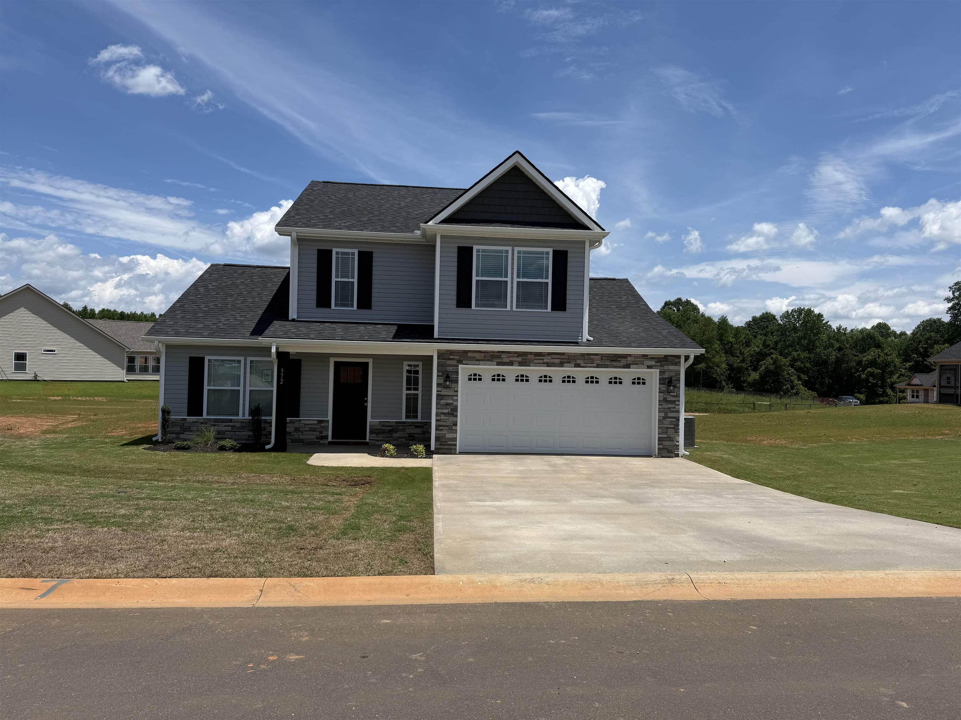 Charming New Homes in Mills Gin, Inman, SC  Welcome to Mills Gin, Inman’s newest  neighbourhood ! Nestled in the heart of this charming South Carolina town, Mills Gin offers a perfect blend of modern living and small-town charm.  Enjoy brand-new construction with thoughtfully designed homes featuring open floor plans, stylish finishes, and spacious yards—perfect for families, entertaining, or relaxing. Conveniently located near schools, shopping, and dining, Mills Gin is ideal for those seeking comfort and convenience in a peaceful setting.  Don’t miss your chance to be part of this exciting new community. Schedule your tour today and find your dream home in Mills Gin!
