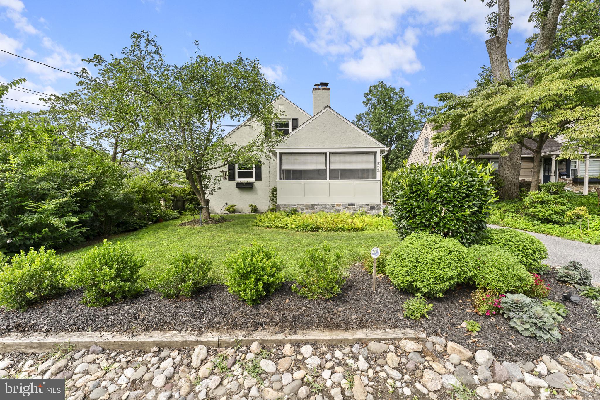 Welcome to 552 Woodside Ave, a beautifully maintained home set on a level lot in one of Berwyn's most sought-after family neighborhoods. This home blends classic charm with everyday convenience, all within easy walking distance to the train station, local shops, and restaurants. Ample off-street parking with a four-car driveway makes coming home, and hosting guests, effortless.Step inside to an open floor plan where an updated kitchen and dining space flow seamlessly into a living room anchored by a cozy wood-burning fireplace. A clever pantry sits just off the kitchen, leading down to the full basement, where you'll find abundant storage, laundry, and Bilco doors that open right out to the backyard. Just off the living room, a door leads to the screened-in front porch, the perfect spot for a summer evening or a quiet cup of coffee on a crisp morning. Rounding out the first floor are three comfortable bedrooms and a recently renovated full bathroom with tub.Upstairs, the primary suite is a true retreat, washed in natural light with its own en-suite full bath, offering a private escape from the rest of the day.Outside, the backyard is a destination in its own right. Mature landscaping and low-maintenance perennial plantings create your own private oasis, fully enclosed by a fence that keeps kids and pets safely contained. The space is even registered as a pollinator pathway, adding to the sense of quiet retreat.Walkability here is the real deal. Trader Joe's, Handel's Ice Cream, Barre3, Parlor Donuts, the Easttown Library, the Berwyn Farmers Market, parks, and a great restaurant scene are all within easy reach on foot. This is the kind of neighborhood where you can park the car for the weekend and just enjoy the community around you. And the community itself is something special: streets glowing with luminaries on Christmas Eve, and Halloween trick-or-treating that makes for the kind of childhood memories that stick. All of this within the top-rated Tredyffrin/Easttown School District. Don't miss the opportunity to make this well-loved Berwyn home your own. Schedule a showing today.