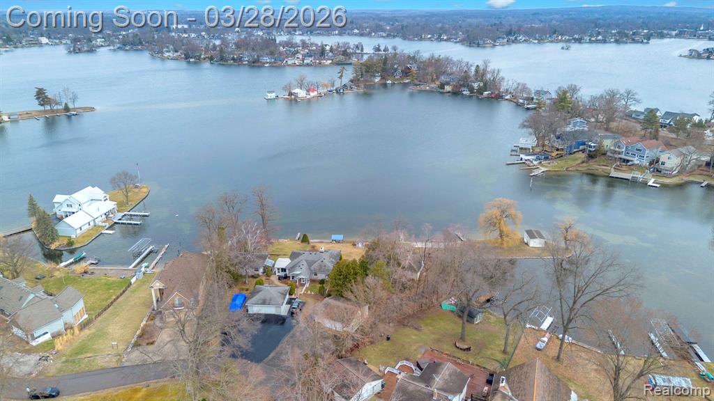 Experience lakefront living on this rare all-sports lake property, offering an impressive 386 feet of water frontage on a private half-acre lot. Set on a deep, secluded parcel, this 2,000 sq ft home features 3 bedrooms and 3 full baths with a flexible multi-level layout that offers both functionality and opportunity.The expansive outdoor setting is the true highlight, featuring multiple boat docks, a boat garage, and a pergola overlooking the water, perfect for entertaining, relaxing, or enjoying panoramic lake views year-round. The depth and privacy of the lot create a unique setting rarely found on lakefront properties, offering both space and seclusion.A 2.5-car garage and extended driveway provide ample parking for guests, gatherings, or recreational vehicles. Whether you're envisioning a full-time residence, seasonal getaway, or a value-add investment, this property presents endless potential to create a truly custom waterfront retreat.Ideally located just minutes from Downtown Lake Orion’s dining, shopping, and entertainment, as well as top-rated Lake Orion schools, this home offers the perfect balance of privacy and convenience.A rare opportunity to secure substantial lake frontage, usable land, and long-term upside in one of the area’s most desirable all-sports lake communities.
