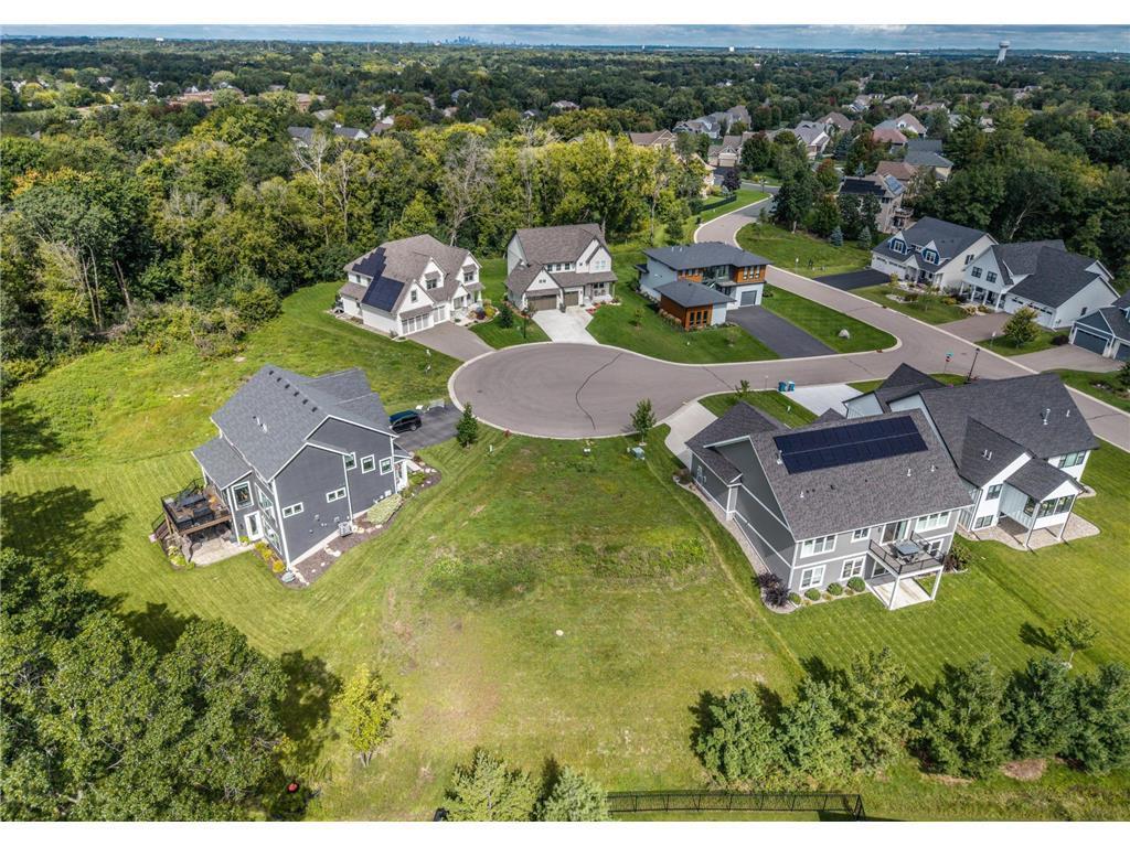 Exceptional opportunity in Amberwood of Inver Grove Heights—an upscale, sought-after neighborhood within School District 196. This prime walkout lot is perfectly positioned on a quiet cul-de-sac, offering both privacy and convenience. Surrounded by natural beauty and located near a woodland preserve with scenic walking and biking trails, it’s an ideal setting for your future home. Nestled within a vibrant and welcoming community, this vacant lot provides a rare chance to build exactly what you’ve envisioned. Stone Cottage offers custom home construction with a variety of thoughtfully designed floor plans and site options. Whether you prefer a classic two-story or easy one-level living, their expert craftsmanship and attention to detail will bring your vision to life. Enjoy the best of both worlds—peaceful surroundings with easy access to nearby parks, local dining, shopping, and everyday essentials. This is your chance to create a home tailored to your lifestyle in one of Inver Grove Heights most desirable neighborhoods.
