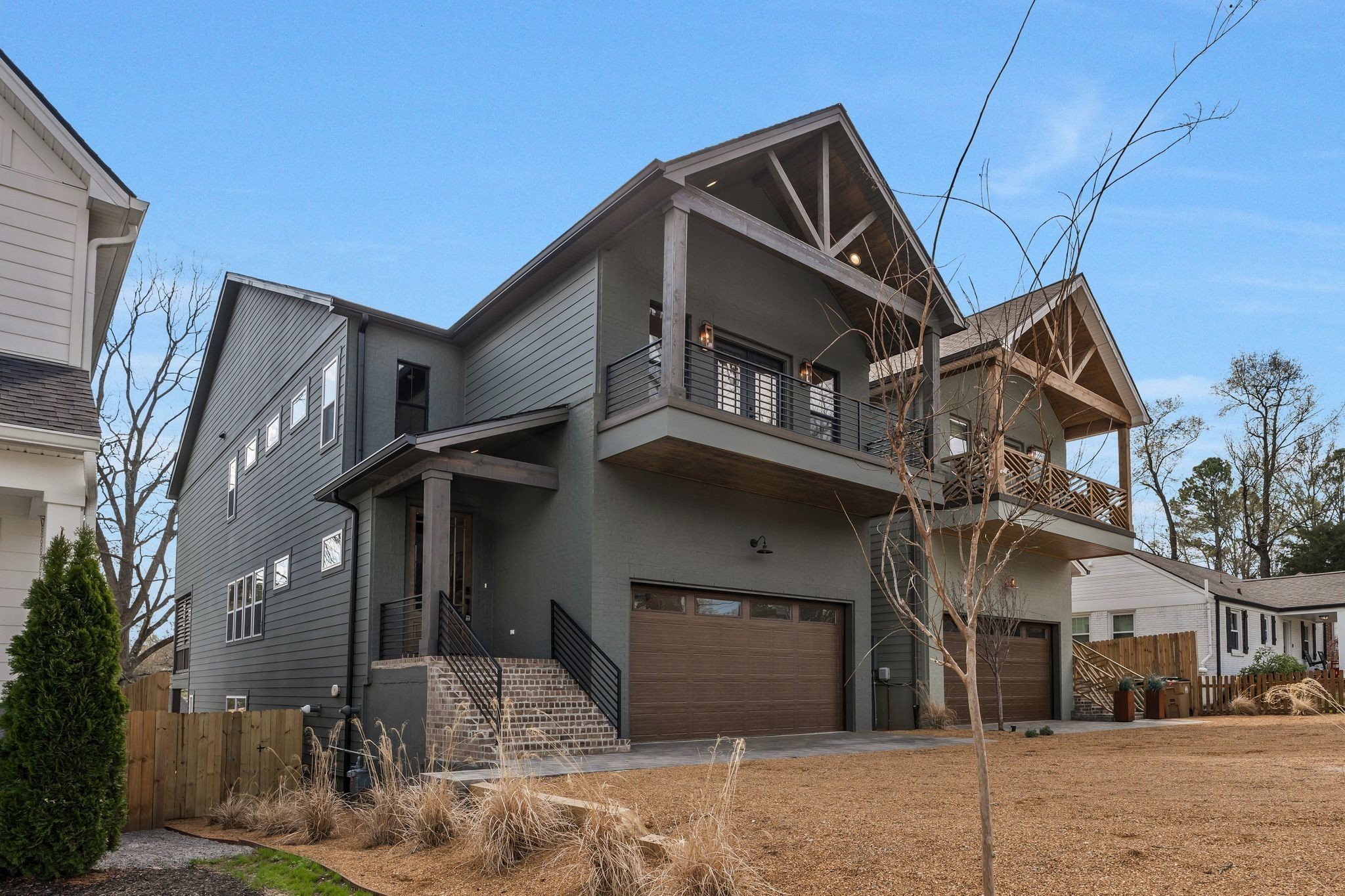 Nestled just 10 minutes from Downtown Nashville, this exquisite new construction home combines sleek modern upgrades with practical living spaces. A three-story design with a fully finished walk out basement ensures ample room for family living. The Walk Out basement includes a Full Kitchen with appliance, gas fireplace, bedroom, a full bathroom, walk in closet and full laundry room and access to a covered back patio that enhances the home's indoor-outdoor flow to fully fenced in back yard. On the main level, a beautiful foyer with herringbone design hardwood floor that leads into a spacious living room with an gas fireplace while the adjacent kitchen features stunning white quartz countertops, a large island, stainless steel appliances, including a wine frig and beautiful tile backsplash with eat in nook.  The walk-in pantry, floating shelves design in kitchen and additional cabinetry provides abundant storage space. The main level also includes a full bedroom or office with full bathroom.  A mudroom cubbie leading to the two-car garage. Upstairs, the home is designed for comfort and functionality, with four bedrooms and three full bathrooms and a half bathroom. The luxurious primary suite includes a walk-in closet and an en-suite bath with a HUGE tile walk-in shower. Two of the secondary bedrooms each have their own bathrooms and the fifth bedroom/optional bonus room has its own walk out covered balcony. Combining luxury, convenience, and an unbeatable location, this home is a rare find in Nashville’s sought-after market.  Owner Occupied Airbnb or rental (basement can be accessed separately allowing this to be a great option if desired)