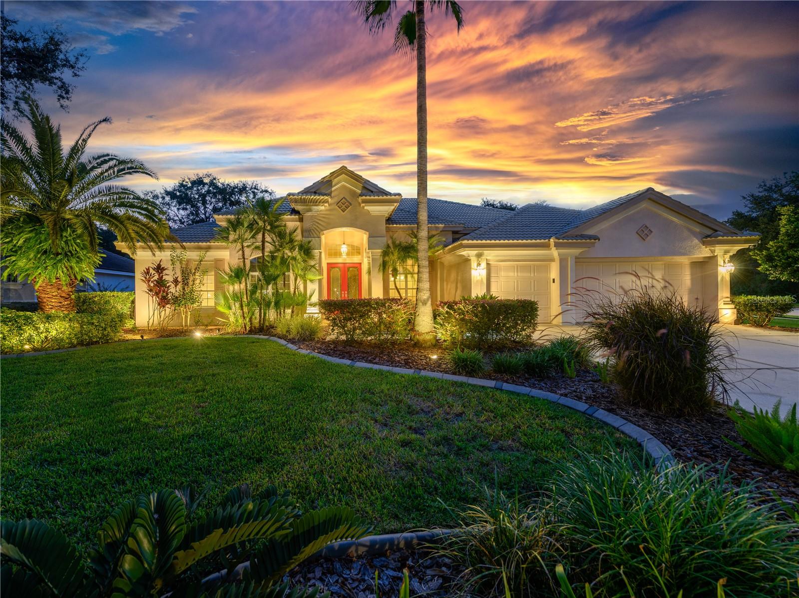 Motivated Seller. Welcome to your exquisite beautifully maintained move-in ready Arthur Rutenberg Mediterranean Revival home situated behind 2 separate gates of the prestigious village of Enclave in Arbor Greene. Set on an oversized corner lot of more than half an acre, this home offers rare privacy with lush mature landscaping and quiet established conservation views. This family home has ample room for visiting guests. If desired, the perfect single level retirement home. The spacious floor plan offers 5 bedrooms (one with built in desks and storage), 3 full bathrooms and a large bonus room with conservation views. The main house is paved in Travertine stone, other areas with porcelain wood plank tile, and with brand new carpeting in the Master Suite. Both the formal and informal living areas open seamlessly through disappearing pocket sliders to an oversized screened lanai and pool deck - perfect for entertaining, relaxing or simply enjoying Florida living at its best! The Chef’s Kitchen opens to the family room and has a large center island with extra storage, granite counter tops, 42” white wood cabinets with slow close drawers and doors, closet pantry, sprawling breakfast bar and breakfast nook with views of the pool and conservation land. Architectural bonuses feature a formal living room with coffered ceiling, private master suite with tray ceiling, and office and family room built-ins. Master suite features a large bedroom that has access to the pool lanai, with a wall of windows with plantation shutters that views the pool and conservation. The master suite includes two large walk-in closets. The Master bathroom has separate sinks with granite counter tops, a Jacuzzi garden tub, and large walk-in shower. Two spacious secondary bedrooms share a Jack and Jill bathroom with double sinks with granite counter tops. The 4th bedroom near the back of the house, adjacent to a bathroom across the hall and the bonus room could be used as a guest or mother-in law suite. The saltwater pool, with an in floor cleaning system and solar heater, is surrounded by a pavered deck, extended screened lanai and conservation views. House includes a 3-car Garage. Recent full home inspection, 4 point inspection, and certified roof inspection were performed. The roof received a 15-year certification from the licensed roof inspector. Arbor Greene residents enjoy 24 hour gated security, resort-style amenities, community pools, fitness center, tennis courts, playgrounds, and miles of walking trails. This property’s prime location offers both tranquility and convenience, with top-rated schools, shopping, dining, and major highways just minutes away. Don’t miss the opportunity to own one of the most desirable home sites in Arbor Greene—an oversized conservation lot paired with a meticulously cared-for home with truly outstanding curb appeal.