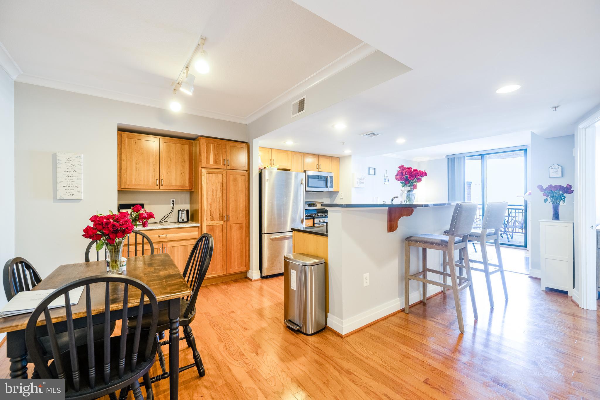 Discover city living at its best in 414 Water Street Unit 1108, a beautifully maintained condo in the heart of downtown Baltimore. This bright and open residence features contemporary finishes, including a modern kitchen with granite counter-tops, stainless steel appliances, and generous cabinet space. The spacious living area flows effortlessly to a uniquely large private balcony—a rare find that offers ample room for outdoor dining, entertaining, or simply relaxing above the bustle of the city.Residents of 414 Water Street enjoy a full suite of resort-style amenities, including a rooftop pool with skyline views, a state-of-the-art fitness center, a resident lounge, business center, 24-hour front desk, and secure garage parking. Perfectly situated just steps from the Inner Harbor, Harbor East, and some of Baltimore’s best dining and entertainment, this home offers an unmatched combination of style, comfort, and convenience. Whether you’re seeking a vibrant urban lifestyle or a low-maintenance retreat close to everything, Unit 1108 delivers space, light, and luxury in one of the city’s most desirable high-rise communities.