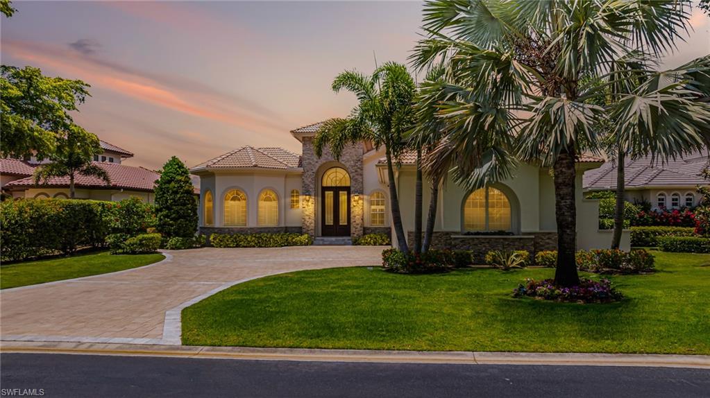One or more photo(s) has been virtually staged, AI generated or rendered.  This exceptional 3-bedroom plus den, 3.5-bathroom estate home in West Bay Club has been extensively upgraded and expanded to offer the perfect blend of luxury, functionality, and relaxed elegance. Designed with quality finishes and thoughtful details throughout, the home features a spacious open floor plan ideal for both everyday living and entertaining. The chef’s kitchen is a true culinary showpiece, featuring a 42-inch natural gas burner, twin Sub-Zero wood-paneled refrigerator and freezer, Miele cappuccino/coffee maker, steamer, warming drawer, double ovens, granite countertops, a separate prep island with sink, abundant cabinetry, and a breakfast bar that flows into the informal dining area overlooking the pool. The expansive living room offers custom built-ins, a glass fireplace, floor-to-ceiling sliders, and surround sound, while the formal dining room includes a built-in wet bar. The den is outfitted with rich built-in cabinetry and an elegant workspace. The massive primary suite is a peaceful retreat with a sitting area, fireplace, 10-foot pocket sliders that open directly to the lanai, and a spa-like bathroom with a soaking tub, walk-in shower with multiple shower heads, and dual vanities. A separate casita provides a private guest suite with its own entrance and access to the lanai. The real highlight of this home is the outdoor living space—perfectly designed for year-round enjoyment with a sparkling pool and spa, a fully equipped summer kitchen, and multiple areas for dining, lounging, and entertaining, as well as a separate screened lanai with stunning views of the natural preserve and breathtaking western sunsets. Whether you're relaxing poolside with a book or hosting guests for sunset cocktails, this outdoor sanctuary captures the essence of Florida living. Residents of West Bay Club enjoy access to world-class amenities including a private Beach Club on the Gulf of Mexico, championship golf, tennis and pickleball, a boat ramp with direct Gulf access, a resort-style pool and spa, state-of-the-art fitness center, and a beautifully appointed clubhouse with both fine and casual dining. Ideally located east of US 41, you're just minutes from Coconut Point, Miromar Outlets, Hertz Arena, and 20 minutes from Southwest Florida International Airport. This remarkable home and community offer the best of luxury living in Southwest Florida.