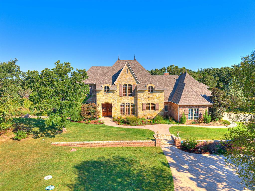 Set on nearly seven acres inside Edmond city limits (and just a mile north of Pops), this exceptional estate offers the rare mix of luxury, space, and smart efficiency. The home includes 4 bedrooms, 3 full baths, 3 half baths, two spacious living areas, a dedicated study, bonus room, hobby room, plantation shutters, a walk-in pantry, and 3.5 garage stalls—designed for comfort and everyday ease. Step outside to your own private retreat: a sparkling pool with hot tub, colorful flower gardens, a stocked pond, and an irrigated garden ready for fresh seasonal produce. Evenings are easy to enjoy thanks to the mosquito misting system. Major improvements add value and peace of mind, including three geothermal units (all under three years old), a new hot water tank in 2024, and a high-impact, hail-resistant roof installed in2019. A generator, continuous hot water, and an impressive 300-mph safe room elevate both security and convenience. Resort-style living meets city accessibility here — a truly special Edmond property that’s ready to be enjoyed