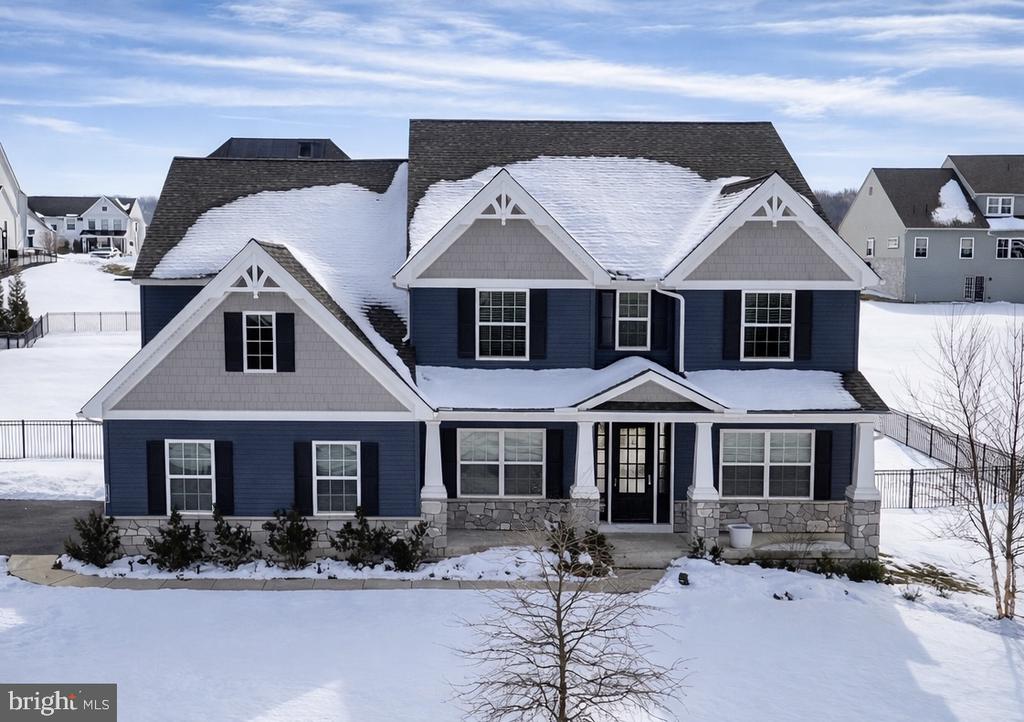 This beautifully designed home offers 4 bedrooms, 2 full baths, 2 half baths, and a two-car garage, all within a thoughtfully crafted layout ideal for modern family living.Step inside to a bright, open foyer that immediately feels welcoming. To the left, a formal dining room awaits your next holiday gathering or special occasion. On the right, a private study provides the perfect space for working from home or quiet productivity.The main level opens into a spacious family room featuring a cozy gas fireplace for chilly winter nights and an elegant coffered ceiling that adds architectural character.The gourmet kitchen is truly the heart of the home, showcasing upgraded cabinetry, a dedicated coffee station, a five-burner gas cooktop with vent hood, and an oversized island with generous seating—ideal for entertaining and everyday living. A walk-in pantry offers abundant storage, and the adjoining breakfast area provides a comfortable spot for casual meals.A functional mudroom with a large closet connects conveniently to the two-car garage, which includes additional storage space.Upstairs, the expansive primary suite offers a private retreat, complete with a spa-inspired bathroom featuring a freestanding soaking tub, a walk-in tiled shower, dual vanities, and a spacious walk-in closet. Three additional generously sized bedrooms—each with its own walk-in closet—share a hall bath with double sinks to simplify busy mornings. A well-appointed laundry room with washer and dryer adds everyday convenience.The partially finished basement includes an additional powder room and offers flexible space for a media room, home gym, or play area.Residents of Ventry at Edgmont Preserve will enjoy exceptional community amenities, including a clubhouse with fitness center, outdoor pool, multi-purpose sports court, shuffleboard, sidewalks, and scenic walking trails—one conveniently located just behind the home.Don’t miss your chance to make this exceptional property yours before someone else does!