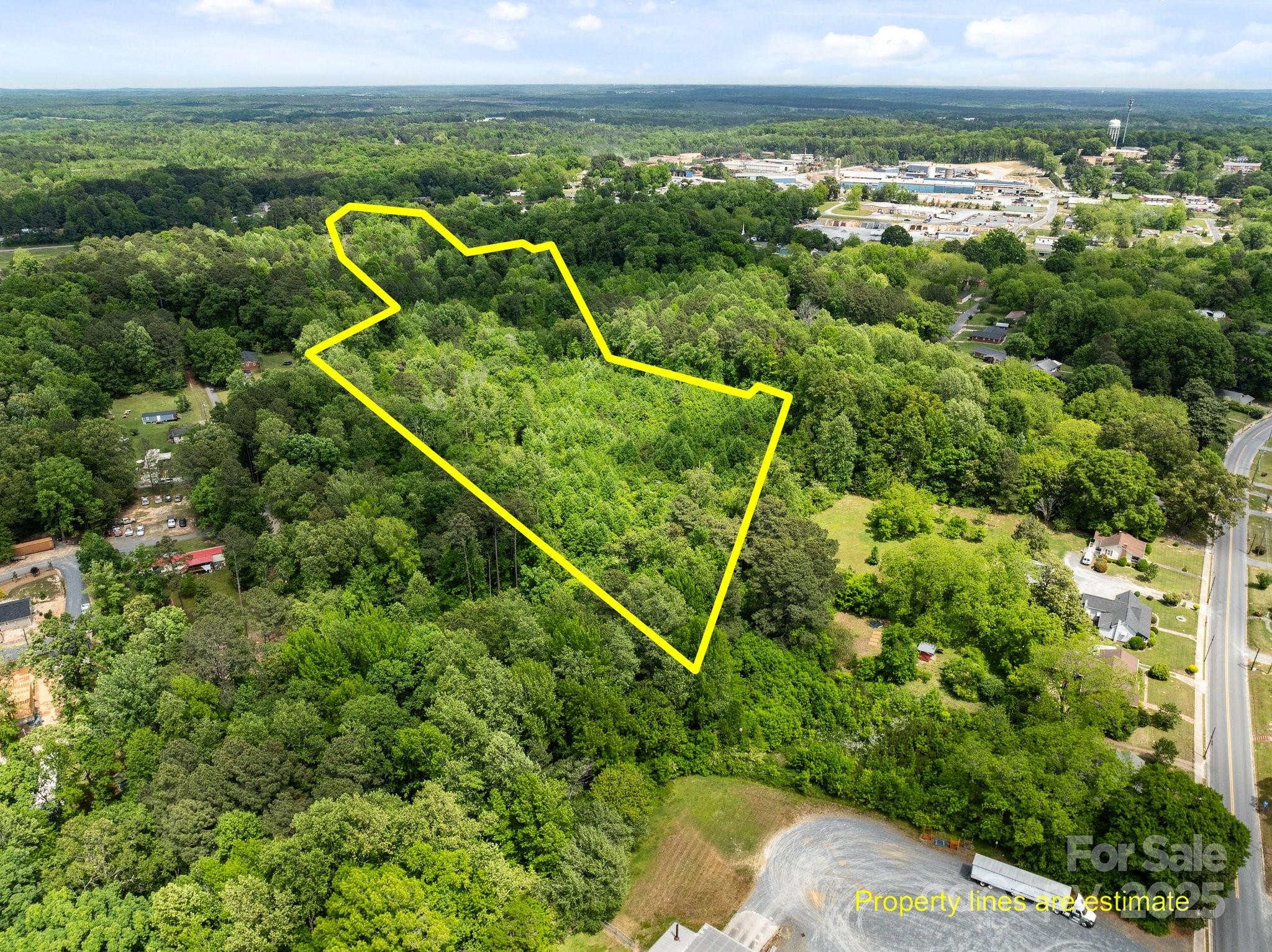 Discover 17.02 wooded acres located within the city limits of Troy, NC—offering a rare opportunity for development! With access to city sewer and positioned for growth, this property provides excellent potential. While there is currently no developed road leading to the site, its prime location and natural setting make it a valuable investment for the future. Don't miss the chance to bring your vision to life in this thriving area!