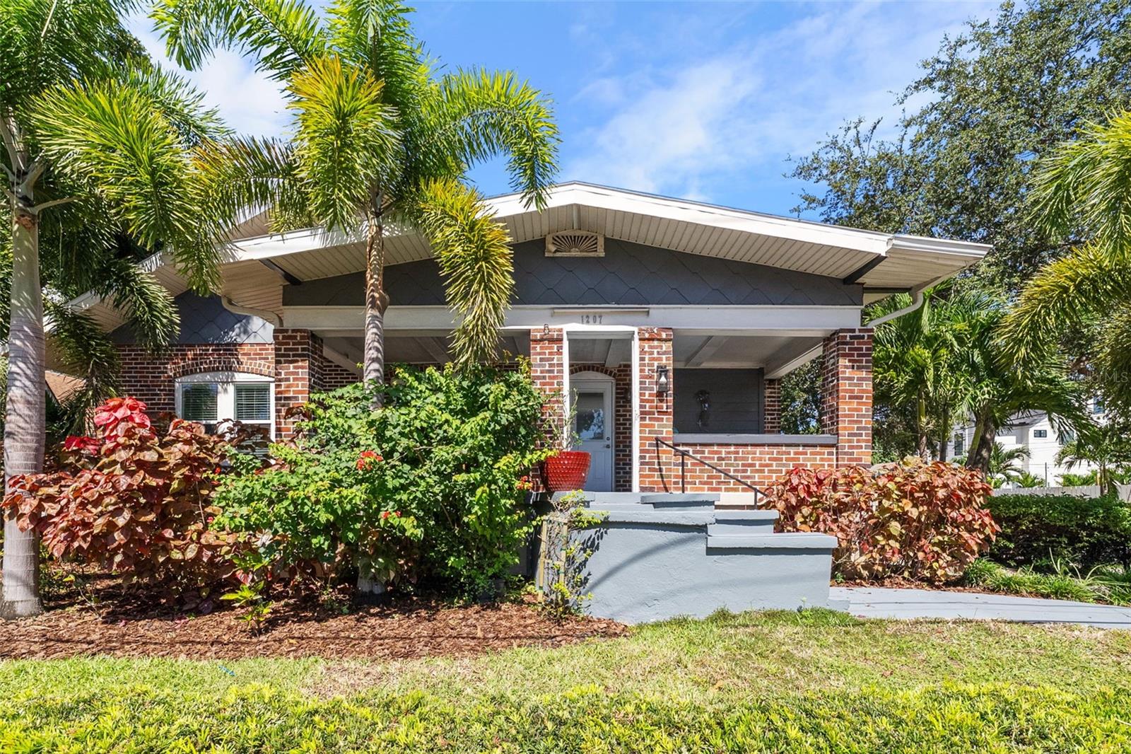 Modern Charm Greets Awaits You In This Beautifully Upgraded, Move-In Ready Home! The Kitchen Renovation was Designed for the Chef at Heart, Quartzite Slab Countertops, Voice Activated Farmhouse Faucet, Top-Of-The-Line Samsung Bluetooth Appliances, Custom Range Hood, and A Handcrafted Backsplash. Bask in the Luxurious Master Suite, Complete with Ensuite Bath Presenting Hotel-Style Finishes. The First Floor Showcases Solid Oak Floors, Three Bedrooms, A Spacious Family Room with A Wood-Burning Fireplace, A Sunroom/Office with Gallery Lighting to Spotlight Personal Treasures, and a Utility/Mudroom, with Expanded Storage Options, Adding a Ton Functionality to This One-Of-A-Kind Masterpiece. The Striking Wood Staircase Leads to the Master Addition, Featuring Bamboo Floors. Enjoy Smart Home Technology, Money-Saving, completely paid off, 4.2 Kw Solar Panels, And Countless Updates: Hurricane-Rated Windows, 2015 Roof, 2016 AC, Vinyl Fencing, and More. Detached Two-Car Garage with a Grandfathered In 1/2 Bath, Adds the Potential of A Future ADU. Off Street Three-Car Brick Paver Parking. Corner Lot with Solid Brick Construction and Raised Concrete Foundation, and in a NO FLOOD, Non-Evacuation Zone, for Even More Security. Located In The Coveted EUCLID/ST PAUL Neighborhood, Just A Short Walk To Downtown St. Petersburg, USF Campus, Shopping, Parks, The Waterfront, with A Vibrant Scene of Music, Art, and Dining. Entertain Under The Massive Pergola While Taking In The Natural Beauty Of Your New St Pete Home! Note: Noise is Never an issue, Ambulances Enter From 5th Avenue, Not 9th.
