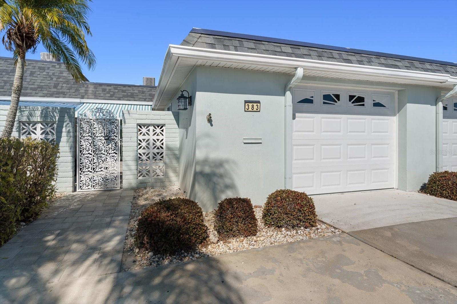 One or more photo(s) has been virtually staged. One or more photo(s) was virtually staged. Welcome to your FULLY REMODELED Florida retreat in the highly sought-after Boca Ciega Point—a quiet, gated 55+ waterfront community where peaceful views, privacy, and resort-style amenities come together.  This beautiful remodeled 2 bedroom, 2 bath home with a 1-car garage and double driveway is truly one of a kind. One of only a few units in the community offering a double driveway with direct entry into the home, you’ll also enjoy no rear neighbors, just a large, lush green backyard plus water views from the back patio, perfect for morning coffee or sunset with a glass of wine. Even from the front patio, you’re greeted with open green space and an island view rather than another unit, creating a rare sense of privacy.  The home has been completely remodeled,  using association hurricane insurance funds, giving you peace of mind along with modern finishes. Some photos have been virtually staged to help you envision just how beautiful this space will feel once you move in.  Final touches already in motion include a new hurricane-rated door from the living room to the office and a new front door, both scheduled to be installed by the association once they arrive.  Living here is refreshingly simple, everything is included (even brand-new fiber internet) with electric being your only utility expense.  Enjoy an active lifestyle with a large pool, pickleball, tennis, and plenty of social activities, all within this secure gated neighborhood. And when you’re ready to explore, you’re just minutes from Madeira Beach, plus great restaurants and shopping.  Homes with this combination of double driveway, water views, green space, full remodel, and privacy rarely come available, don’t miss your opportunity.  Call today to schedule your private showing!