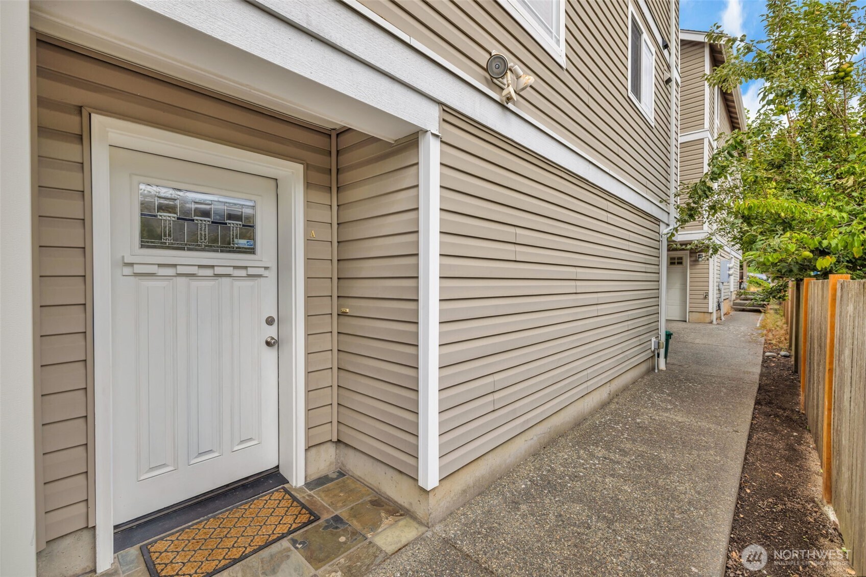This immaculate NO-HOA townhouse is a rare West Seattle find! Beautifully maintained and move-in ready, it features spotless hardwood floors, vaulted ceilings, large windows, and abundant natural light. The open main level connects the kitchen, dining, and living areas—perfect for everyday comfort and entertaining. The spacious primary bedroom includes an en-suite bath, while newer double-pane windows, window shades, washer and dryer, and water heater add comfort and value. Enjoy two private balconies—one off the living room and the other off the primary bedroom, peaceful surroundings, and wonderful privacy. From the kitchen, take in charming views of the neighbor’s fruit trees—and even a glimpse of the mountains when snow blankets the peaks! An attached one-car garage plus an additional reserved parking space off the alley make city living easy. Unbeatable location near Morgan Junction Park, Fauntleroy Way, coffee shops, bars, restaurants, the C Line, and the Fauntleroy Ferry. A peaceful retreat close to everything—this is the one!