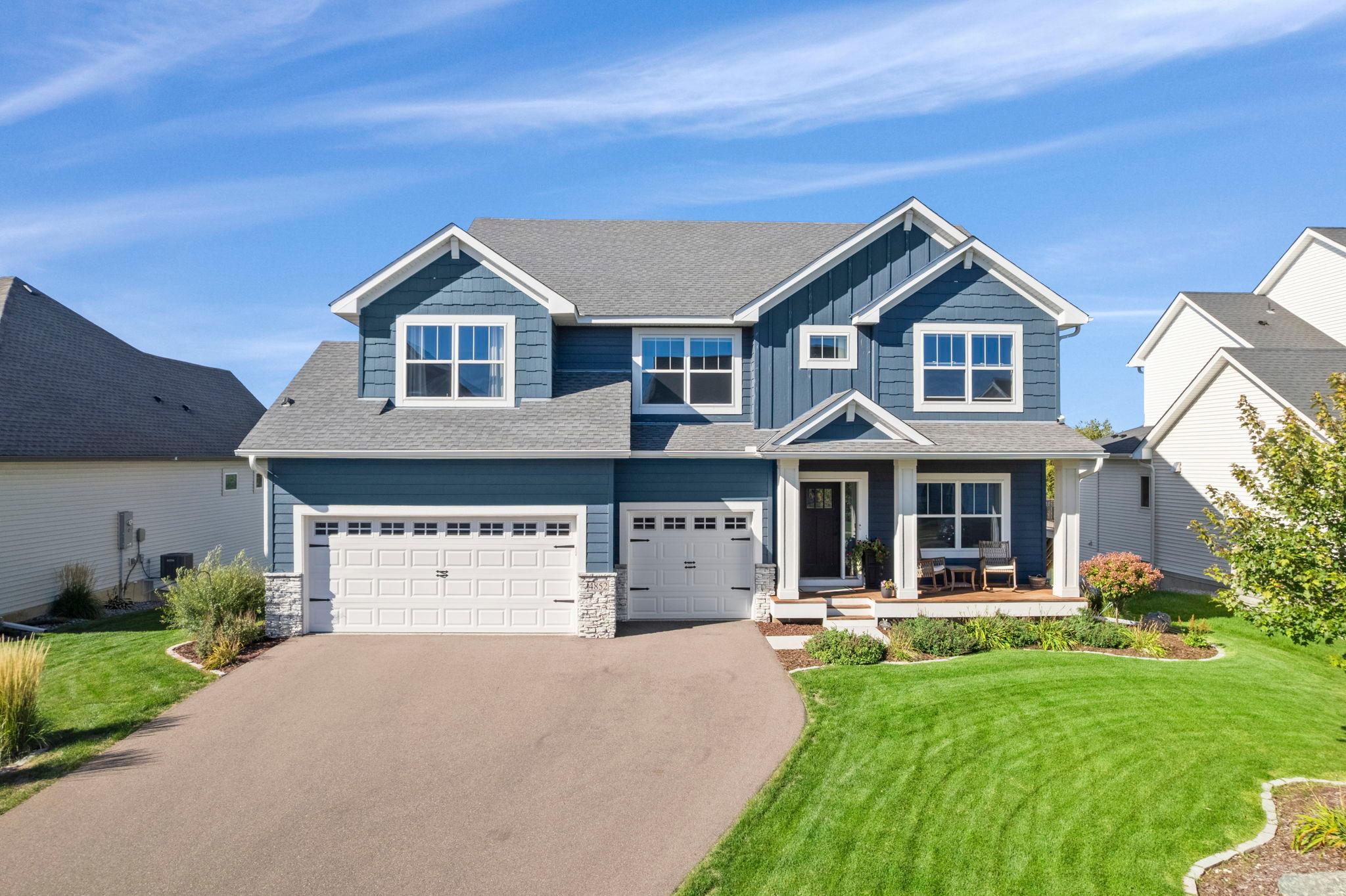 Stunning 2022-built home in a beautiful Prior Lake setting, backing to a pond and wetlands where the views change with the seasons and wildlife is part of the scenery!Inside, thoughtful details give this newer home a little more personality than the typical build, from the wainscoted entry and 9-ft ceilings to the inviting flow throughout the main level.The kitchen features Frigidaire appliances, tiled backsplash, oversized walk-in pantry, and a large center island with seating and storage, opening to the dining area and newer deck overlooking the water.The living room centers around a gas fireplace with white stone and built-ins, while oversized windows frame views of deer, ducks, turkeys, and even sandhill cranes.Five bedrooms, five baths, a main-level office, upper-level den and laundry, plus a finished walkout lower level offer plenty of flexibility!Outside, enjoy a three-car garage with epoxy floors, newer maintenance-free deck, covered patio, fire pit, and a pond that can become a private skating rink in winter.No association, updated landscaping, and minutes to downtown Prior Lake, parks, and outdoor recreation!