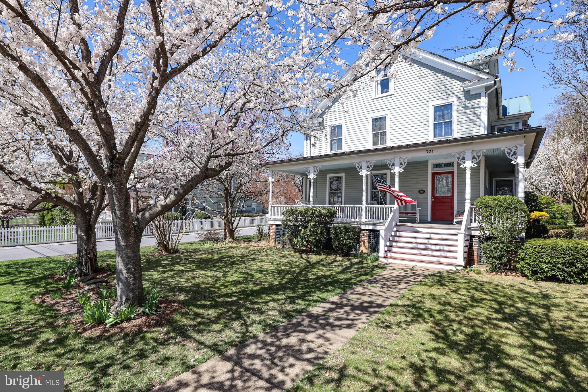 Step into a piece of historic charm in the heart of Purcellville, where July 4th and Christmas parades pass by your Main Street front porch. This 1906 Victorian, and birthplace of local legend Asa Moore Janney, is now offered for the first time in over 40 years. Winner of a 1990 Historic Preservation Award, this rare find has been carefully & lovingly restored showcasing copper main roof and standing seam tern porch roofs (freshly painted in April 2026), wrap around & redecked front porch and more. Situated on a corner lot across from the old stone Purcellville Library, you can walk to coffee shops, restaurants, antique shops and the nearby W&OD Trail. The front entryway boasts a restored oak staircase with newel posts, finials & stained-glass windows. There are oak and pine floors throughout and period details including decorative trim, corner guards, marbled doorknobs, refurbished rim-locks & window pulls. Cast iron steam radiators offer cozy & quiet heat. This beautiful home has wonderful living spaces, perfect for enjoying the best of its surroundings. The living room and master bedroom each feature six sundrenched windows. Four bedrooms, each with its own character, are located on the second level. There are two baths, one with etched windows, and a large walk-in attic with three full sized windows. A deep-set back yard offers a bluestone patio, large shed and fenced vegetable garden, accented by mature and extensive landscaping. This is certainly a rare offering of one of Purcellville's great homes!