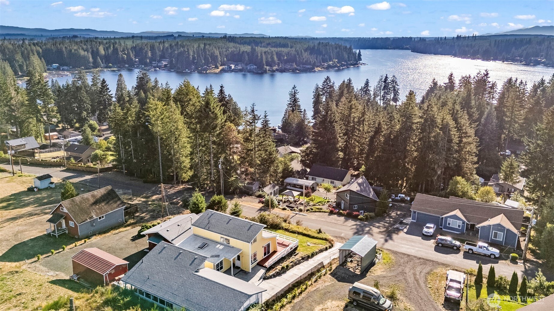 The first time you visit Mason Lake, you may never want to leave. Weekends feel longer, summers feel sweeter, and memories made at the water’s edge seem to last forever. This home brings that lake lifestyle within reach. Inside, an open floor plan and spacious kitchen with quartz countertops pair beautifully with 2 bedrooms, a flex room PLUS a private studio addition complete with its own kitchen and bath. Step out to the large deck, where you can entertain guests and take in tranquil lake views before heading down to the community’s private lake park with dock, swim area, and boat launch. This cabin-style retreat in Paradise Estates is the perfect second home or weekend getaway.  Here, summer doesn’t have to end—the lake is always waiting.