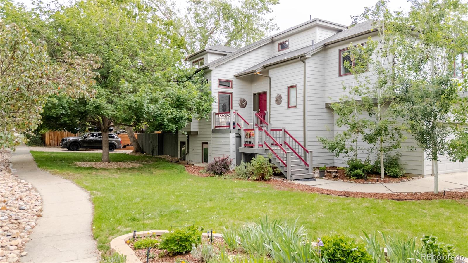 Nestled on a quiet street in one of North Boulder’s most sought-after neighborhoods, this beautifully updated 4-bedroom, 4-bath residence offers refined indoor-outdoor living just minutes from Wonderland Lake, scenic trails, and the vibrant local charm of NoBo. Ideally located just steps away from Lucky’s Market, Bakehouse, popular cafés, restaurants, shops, and public transit, this home perfectly captures the essence of the Boulder lifestyle—where convenience, community, and nature come together seamlessly.Inside, the light-filled interior features fresh updates, and a functional open layout designed for both everyday living and entertaining. The recently remodeled kitchen showcases granite countertops, newer appliances, a gas range, generous prep space, and spacious cabinetry, flowing effortlessly into inviting living and dining areas anchored by a cozy fireplace. Large windows fill the home with natural light from morning to dusk, creating a warm and welcoming atmosphere throughout. Upstairs, the primary suite serves as a peaceful retreat with abundant natural light and flexible space ideal for a sitting area, library, or home office. Secondary bedrooms offer privacy and comfort, while the fully finished daylight basement adds exceptional versatility with a large bedroom, full bath, and expansive media, recreation, or guest space. Set on a private, fully fenced, park-like lot with mature landscaping, the home features an expansive patio and deck perfect for al fresco dining, entertaining, or relaxing beneath Colorado night skies. Enjoy evenings around the fire pit or unwind in the cedar hot tub under the stars. A spacious lawn, oversized patio, and two-car garage complete the property. Just minutes from Pearl Street and downtown Boulder, with access to top-rated schools including Crest View Elementary, this turnkey North Boulder home offers unparalleled access to open space, biking and walking trails, and the peaceful beauty of Wonderland Lake.