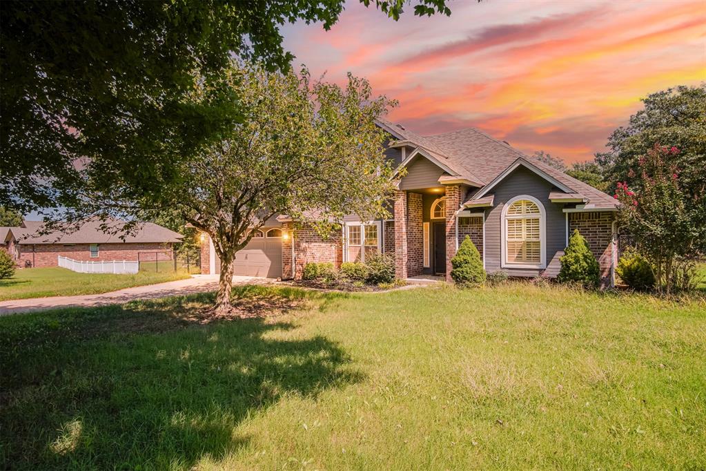 Welcome to 7900 Double Springs Drive, a stunning home that perfectly blends space, style, and comfort on 1.03 acres in Oklahoma City. This beautiful 3 bedroom, 2.5 bathroom property is designed for both everyday living and entertaining. Step inside to find an inviting living room centered around a cozy fireplace, highlighted by massive windows that flood the space with natural light and showcase views of the expansive backyard. The kitchen is a chef’s dream with sleek granite countertops throughout, offering both durability and elegance. The main level features the spacious primary suite and the super spacious sunroom, while upstairs you’ll find two generously sized bedrooms connected by a shared full bathroom. Perfect for family or guests. Hardwood floors add warmth and charm, complemented by plush carpeting in the right places for comfort. Enjoy evenings on the huge back porch overlooking the oversized backyard, ideal for gatherings, outdoor dining, or simply relaxing in your own private retreat. A custom cedar pergola adds a touch of rustic elegance and creates the perfect shaded spot for year round enjoyment. With over an acre of land, a functional floor plan, and timeless finishes, this home offers a rare combination of privacy, space, and style all while being conveniently located near everything OKC has to offer.