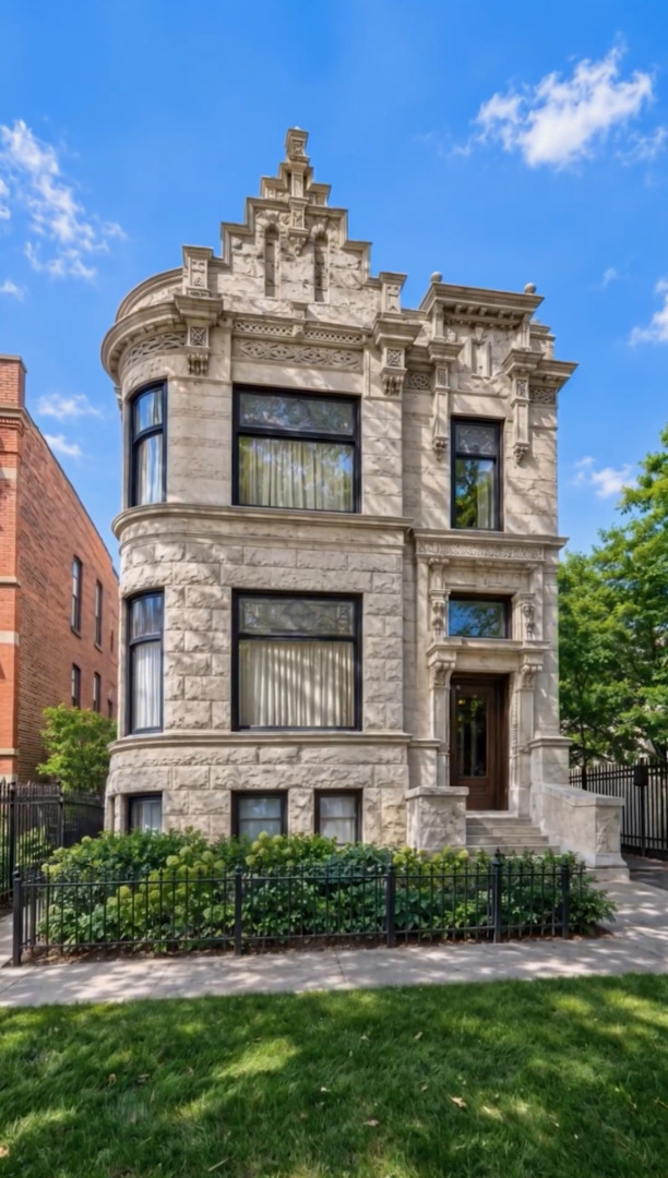 Once in a lifetime opportunity to own a true urban oasis with majestic renovated greystone on 104'x126' vast city compound with charming coach house overlooking picturesque garden in the desirable Bucktown neighborhood. This breathtaking dwelling was meticulously restored to celebrate the original fretwork, cove moldings, oval leaded glass windows, ceiling medallions, oak fireplaces w/antique mantels, original tiles, & oak mirror in entryway. The modern steel & glass additions of jaw dropping solarium off side of home, the glass rear staircase (fabricated by company that made the famous "Bean" in Millennium Park), & sleek chef's kitchen are a masterclass in juxtaposition to intricate original details showcasing the history of this 1896 abode which was brought into the 21st century. Greeted by a stately exterior w/relief carvings & gas lamps, a gracious foyer welcomes you into sunny double parlor living room w/original pocket doors separating formal dining room which boasts a double sided original hutch w/curved beveled glass & custom chandelier by artist Lucy Slivinski made from a tree on property. Legitimate chef's kitchen w/commercial grade appliances, unique natural stone countertops, pizza oven, room for large table, & fresh produce from the property's variety of fruit trees, vegetable garden, & delicious honey from the bee hives on rare urban rooftop garden. The heart of the home is the extraordinary glass atrium solarium off of the kitchen which transports you from an urban environment to being immersed in nature with indoor koi pond and remarkable backdrop of blooming scenic landscaping. The staircase up to 2nd level features wood paneled art gallery to hang your favorites with picture molding. Original fretwork meticulously restored and repositioned on this level to find awe-inspiring 19th century craftsmanship at every turn. Beautiful 2nd floor family room with original display shelving cabinet to anchor the room. Large primary suite boasts pendants which are works of art made from silk chrysalises, large sitting room with curved glass windows and original fireplace, custom-built-ins, large walk-in closet with custom built oval jewelry cabinet, & zen inspired bathroom w/stunning natural stone oversized shower, & antique fixtures such as Chinese soaking tub, vanity, pendants & door for a tranquil spa-like experience. Two-more bedrooms w/shared en-suite bathroom complete the 2nd level. The lower level features radiant heated flooring, 2 additional bedrooms, full bathroom w/steam shower, laundry, dog wash station, & abundant storage. Extra 2BR/2BA apartment on basement level w/its own entrance & kitchen w/high end Sub Zero, Wolf, & Miele appliances ideal for au-pair or in-law suite. The home is equipped w/elevator which goes all the way to rooftop level (this renders the house fully wheelchair accessible) for special walk through a "garden in the sky" professionally landscaped by Intrinsic landscaping w/drip irrigation system w/native perennials & bee hives producing the most delicious diverse honey. The rear of the home has a doggie door leading to smaller fenced in dog yard, firepit, large patio w/amazing Zanzibar door as backdrop on the 2.5 car garage. Parking pad on side of charming 1874 coach house known to house celebrities filming here. This beloved coach house was picked up from behind house next door and moved to its current location with vast front yard and features original pine floors, wood burning fireplace, updated kitchen with Carrera Marble countertops, 2 bedrooms, 2 renovated bathrooms, & lower level family room with another Zanzibar door. The magical yard is filled w/intoxicating blooms from Magnolia trees, and includes apple trees, peach trees, raspberries, gooseberries, & blackberries all w/irrigation system. Located in historic district of Bucktown w/easy access to blue line, 606 Trail, dog park, and all of the best boutiques and restaurants in heart of Wicker Park and Bucktown.